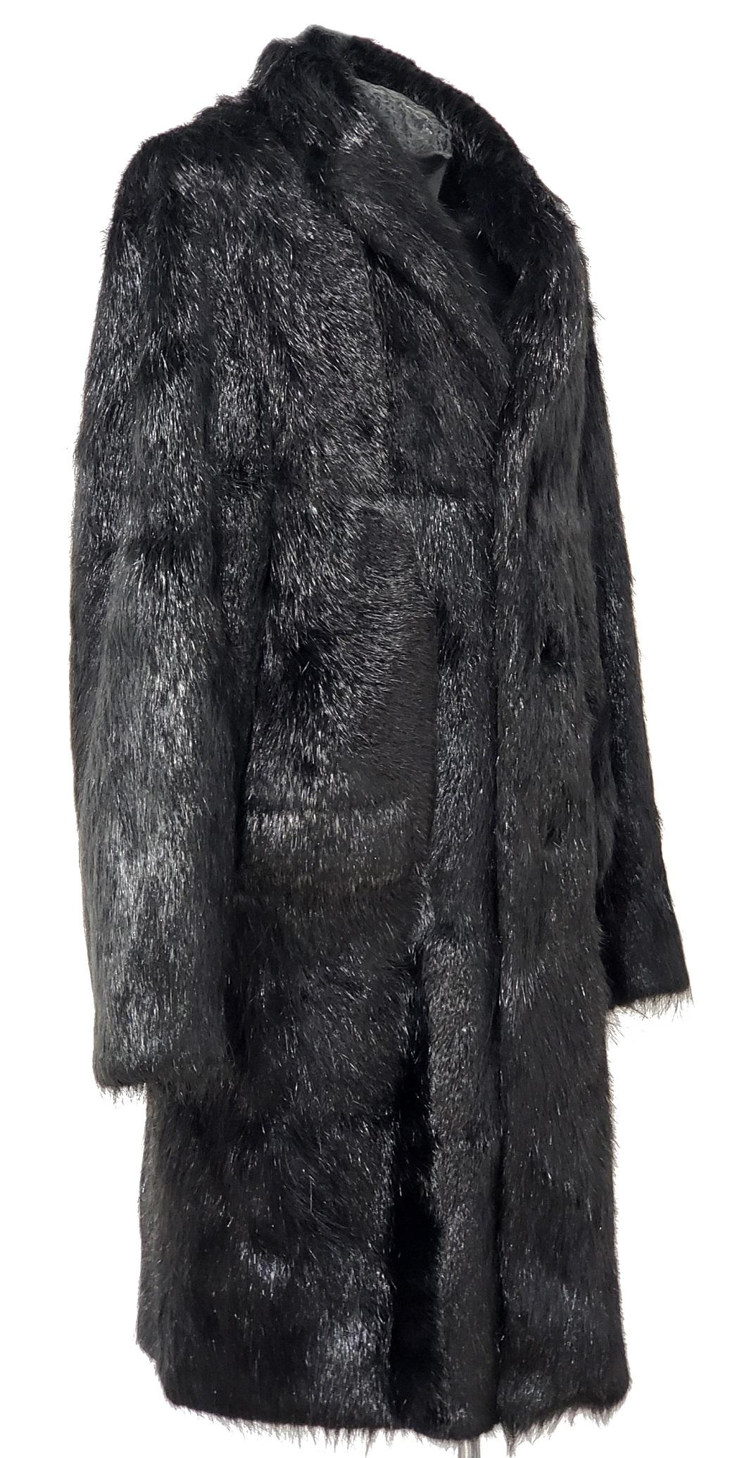 Roberto Cavalli 
Beaver Fur Coat

With its luxurious textures and chic style, this gorgeous coat will add panache to any wardrobe. 
Measures:
shoulder to shoulder - 22