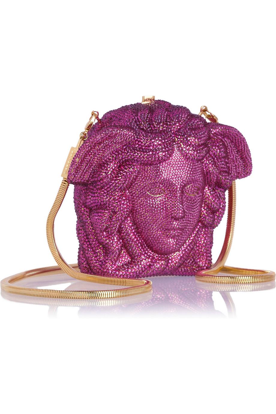 Embellished with hundreds of magenta crystals, Versace's iconic 'Medusa' motif has been re-imagined as a sparkling shoulder bag. This Italian-made design is the perfect size for keeping your lipstick, keys and card close at hand and features