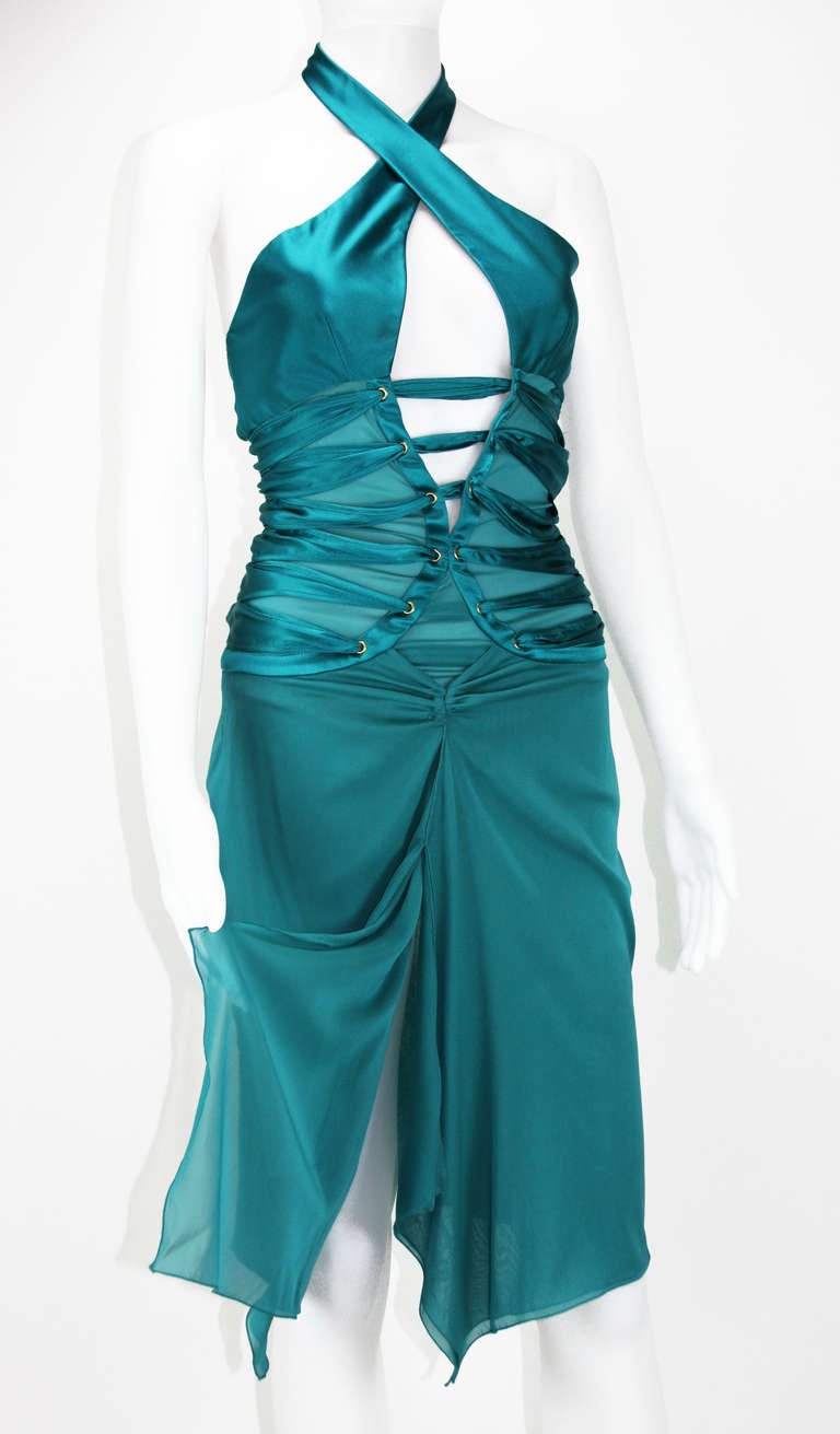 TOM FORD for GUCCI SILK DRESS

ITALIAN SIZE 38 OR US 2

COLOR - PEACOCK BLUE

HALTER STYLE

TRANSPARENT PANELS AT WAIST WITH RIBBON APPLIQUE

GOLD-TONE HARDWARE

BUILT IN LEOTARD BOTTOM UNDERLAY

SIDE ZIP CLOSURE

100% SILK ,