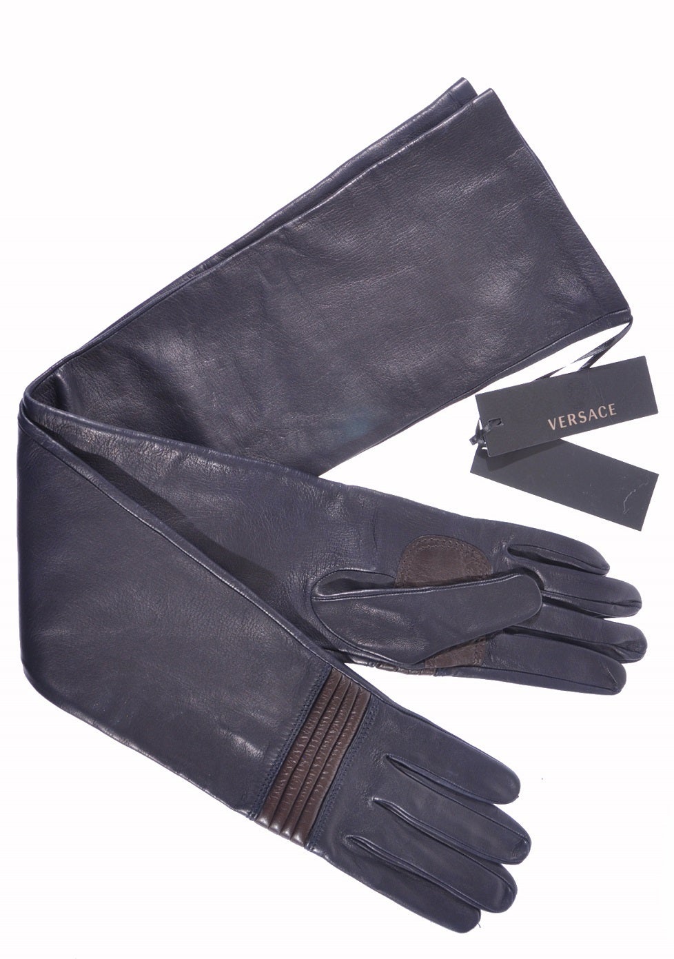 VERSACE gloves

This expertly handcrafted glove will add an element of luxurious Italian style to any outfit. In supple lambskin in delicious dark navy (almost black) color, finished with chocolate quilted leather detail.

Made in Italy.

Size