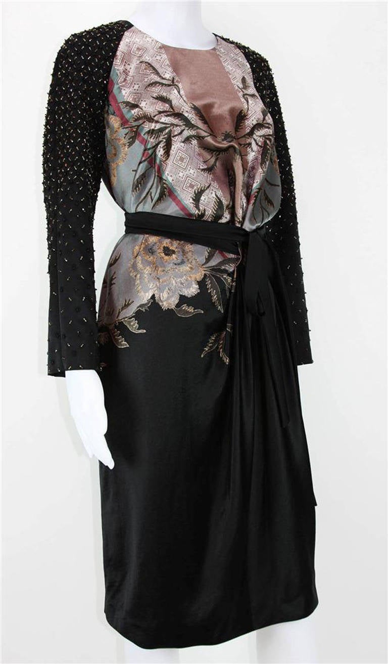 New
 ETRO BEADED & EMBROIDERED BLACK EVENING DRESS
ITALIAN SIZE 44 - US 8
COLORS: BLACK, DIFFERENT TONES OF MAUVE, SOFT BROWN, SOFT GREEN
LONG SLEEVES – FULLY BEADED & EMBROIDERED
HIDDEN BACK ZIP CLOSURE
FLORAL PRINT
DETACHED BELT
FULLY