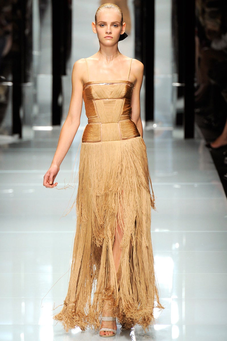 Versace 

Nude Gown

 is finished with a long-length fringe - a key trend this season.

Made in Italy

IT Size: 38 - US 2

Brand New, with tags

Retail price is $13,975.00