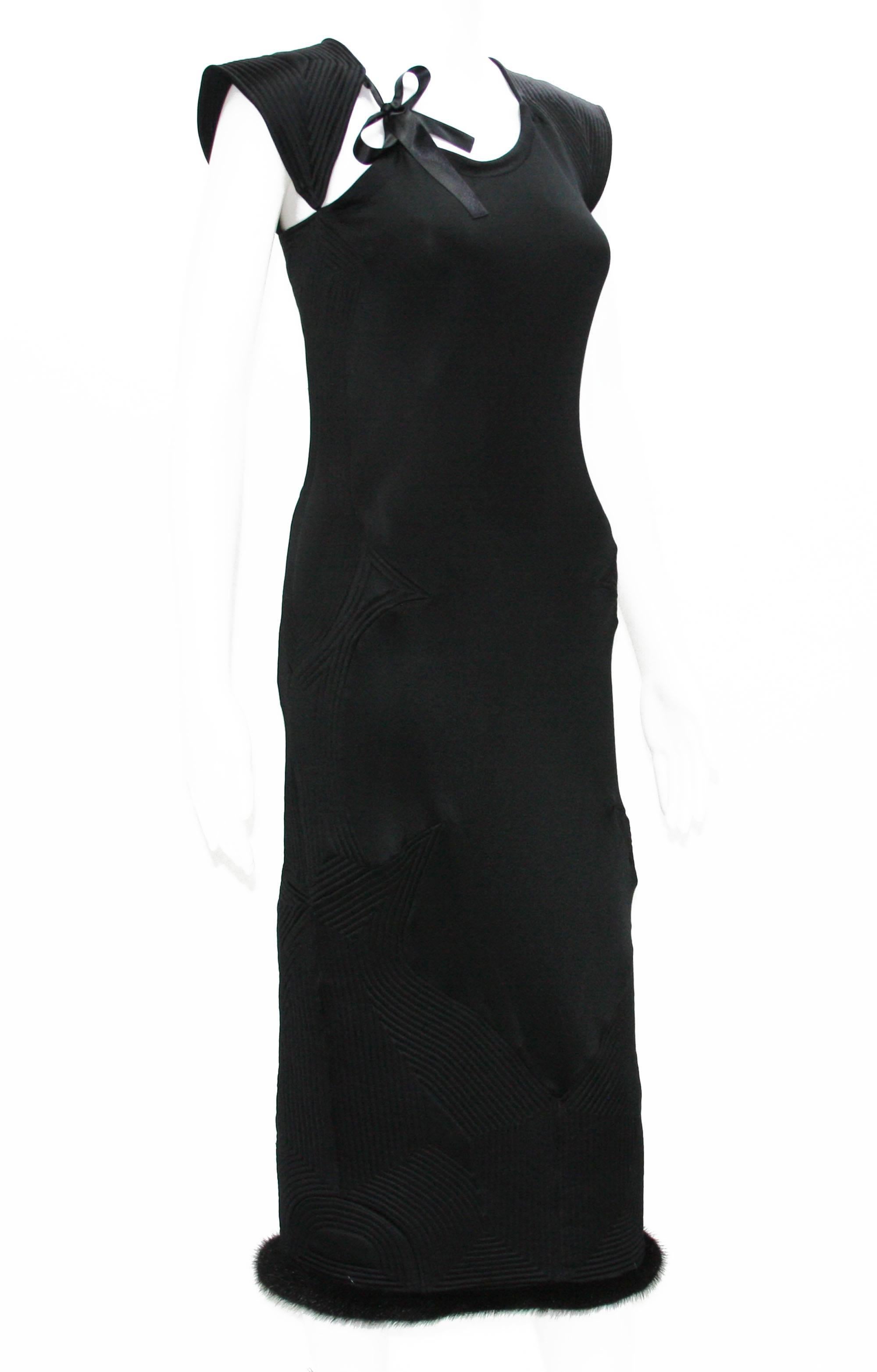 COLLECTIBLE 
TOM FORD for YVES SAINT LAURENT 
BLACK STRETCH DRESS
FALL/WINTER 2004 COLLECTION
DESIGNER SIZE – M
COLOR – BLACK

BOW ACCENTS AT NECKLINE
MINK FUR TRIM AT HEMLINE
ZIP CLOSURE ON SIDE
MADE IN ITALY
PRE-OWNED IN EXCELLENT