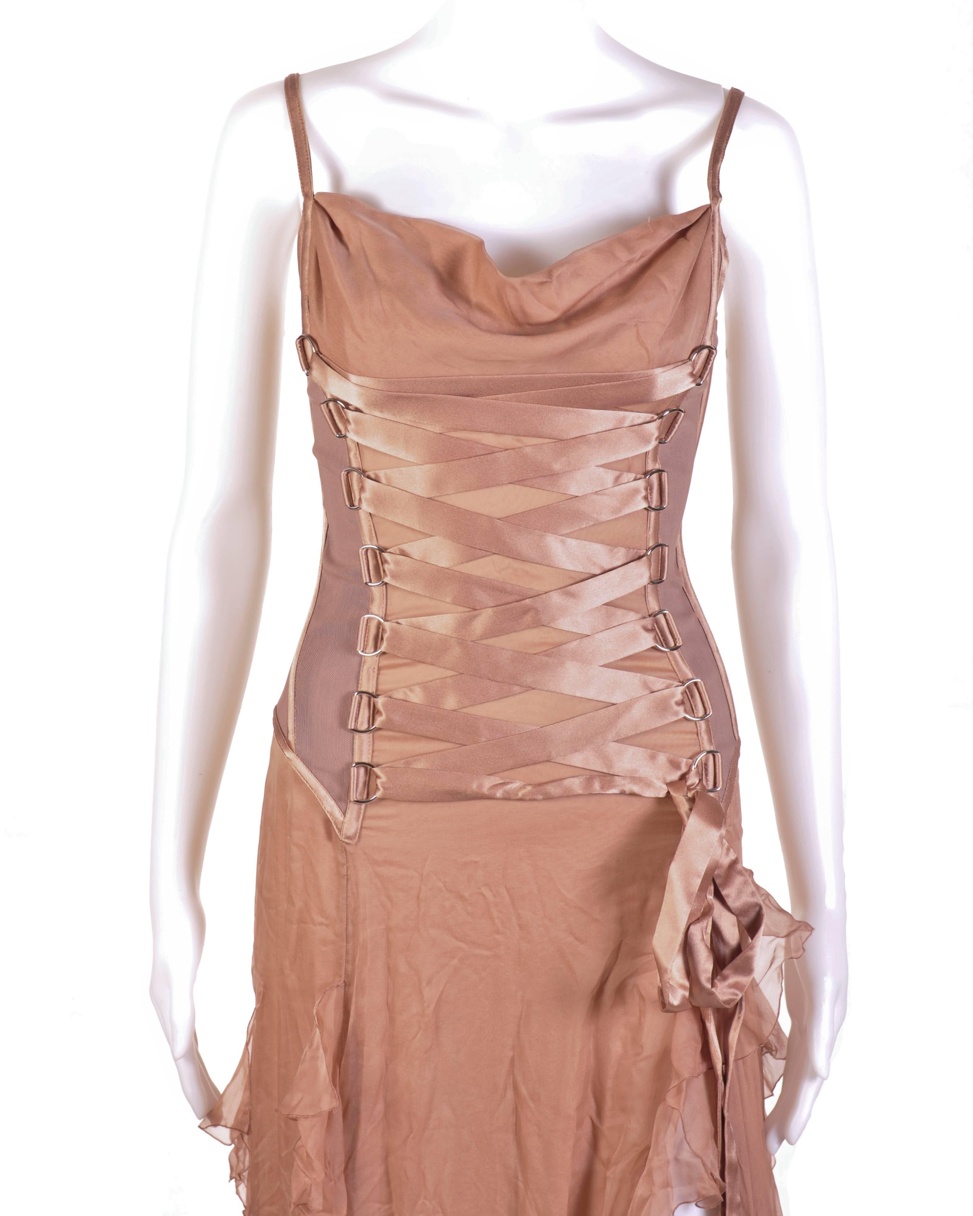 VERSACE Nude Corset Long Dress

Look every bit the fairy tale princess in this
romantic Versace gown. This spaghetti strapped
dress is fashioned with nude, silk chiffon and a
corset-styled bust. The corset is medium weight,
fully lined, boned at the