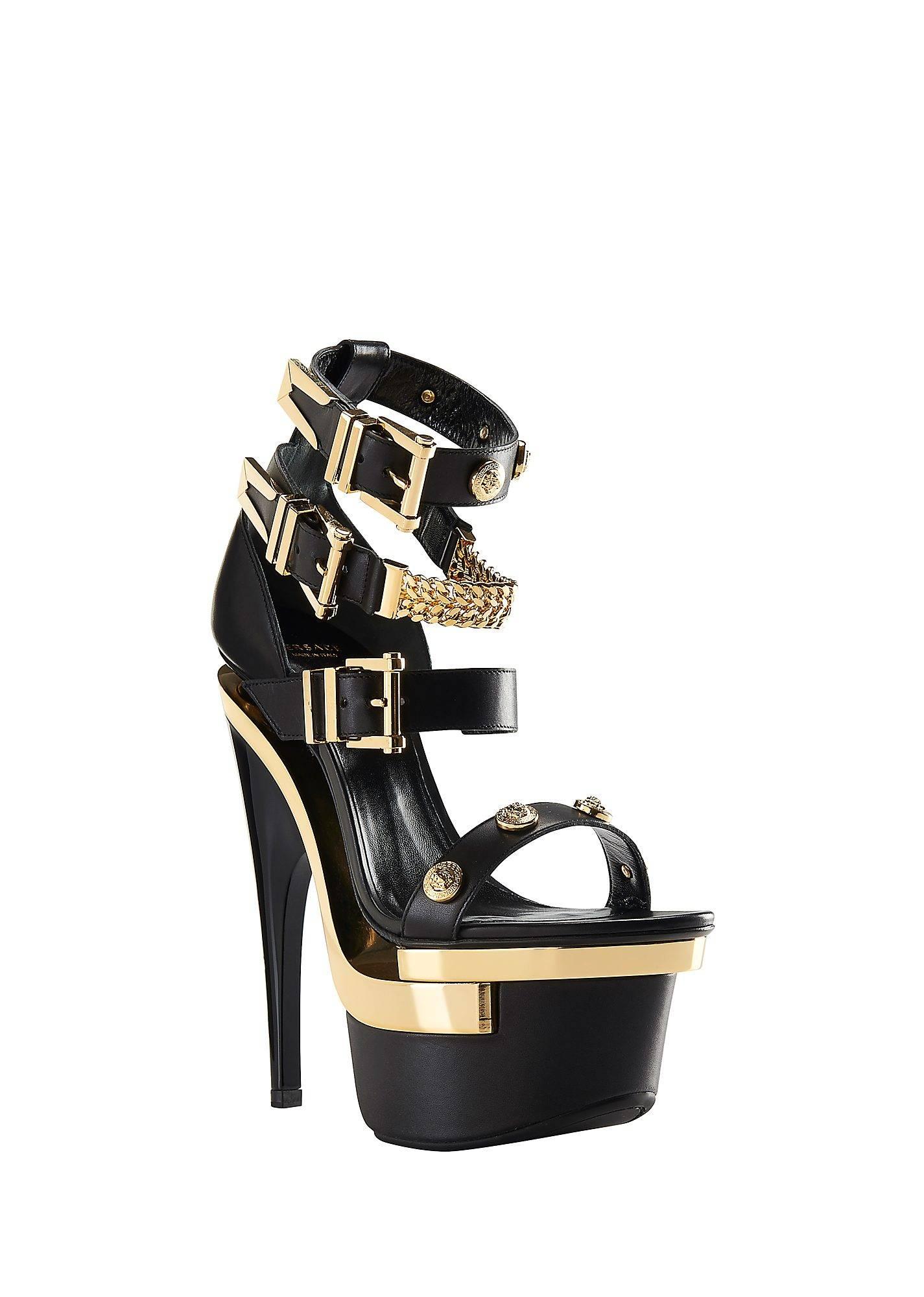 VERSACE 

Studded platform sandals

Three ankle buckles, gold sole plaques, platform at front, stiletto curved heel, heel measures approx. 16 cm

100% leather
 
IT Size 39 - US 9 

Made in Italy

Brand new. In original VERSACE box.