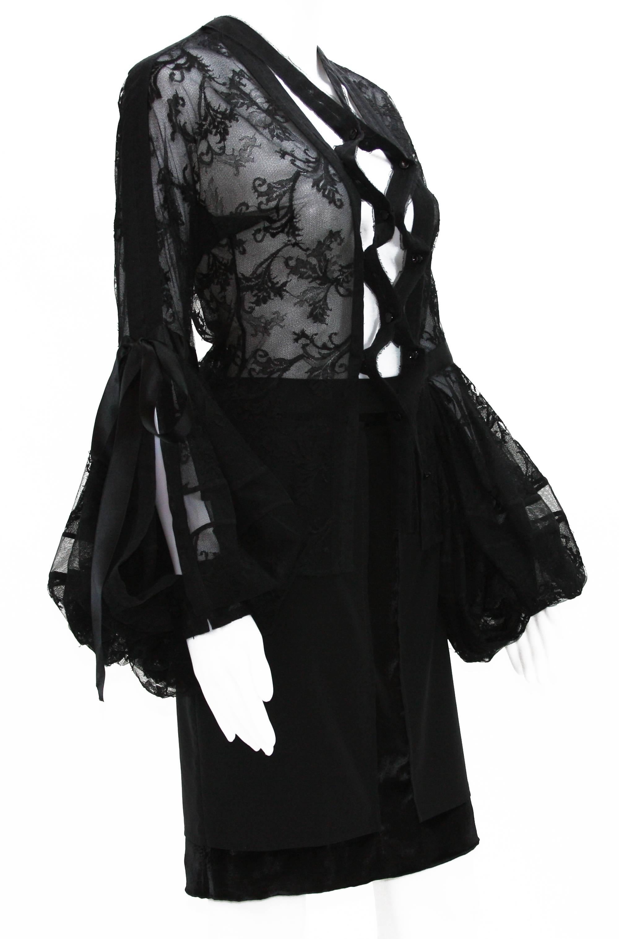 Tom Ford for Yves Saint Laurent Skirt Set
F/W 2002 Collection
Color - Black.
Lace Blouse with Silk Ribbons. Fabric is stretch.
Skirt - Silk and Velvet. Fully lined. Two Back Pockets.
Measurements flat: 
Blouse: Bust - 16 inches, Sleeve - 32.5