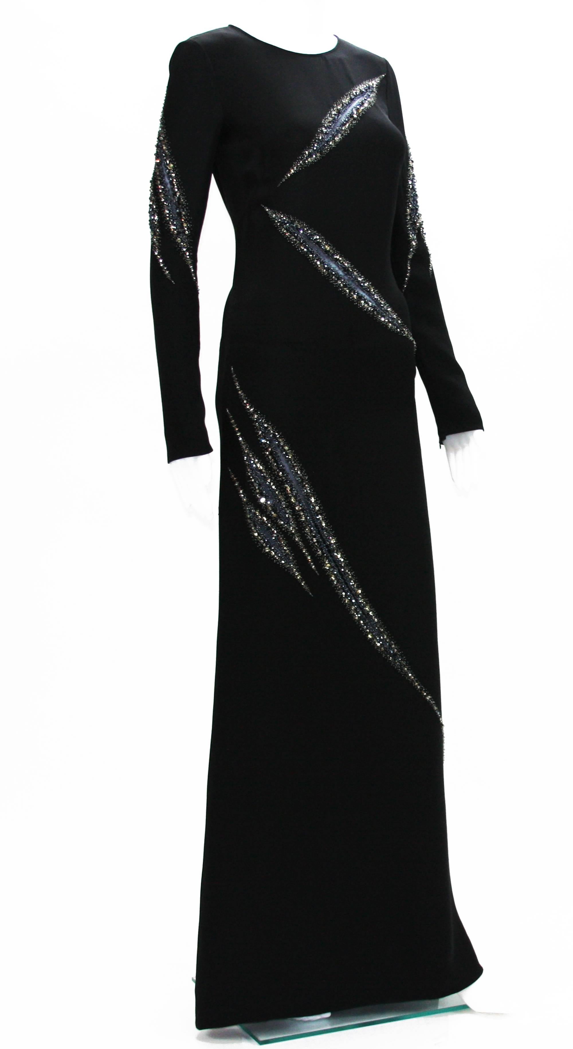 Emilio Pucci Runway Black Embellished Gown.
Sexy Slashed Details Accent with Silver / Black Crystals Embellishments.
This Sleek Dress Featured Gorgeous Embellishing in a Slashed Sheer Inset Pattern All Over. 
IT size 38 - US 4
100% Silk.
Double