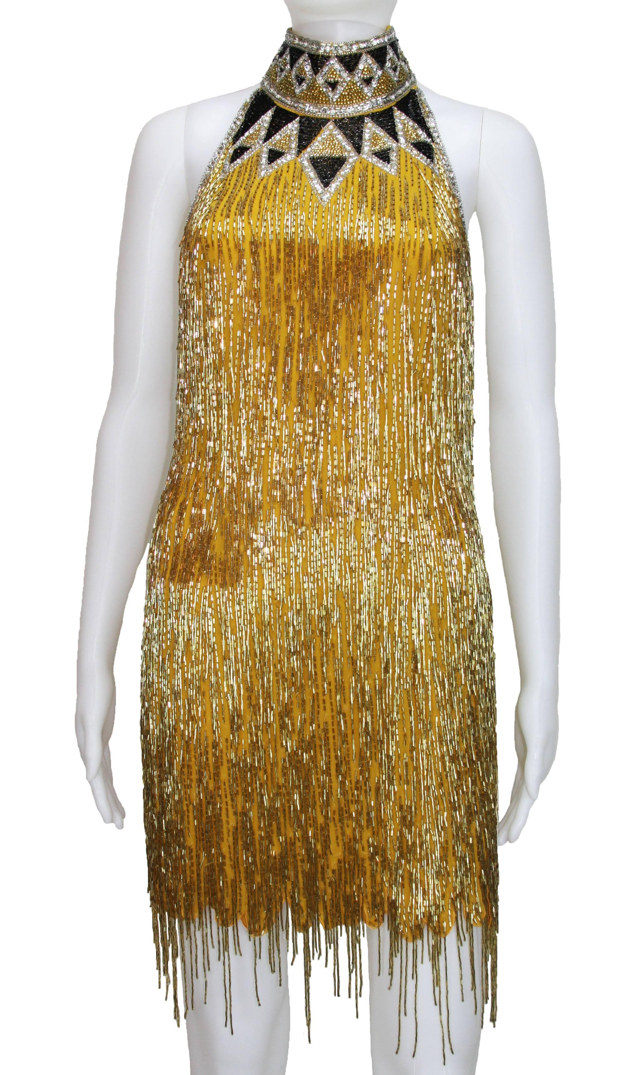 BOB MACKIE

BEADED COCKTAIL DRESS 

Mid 1980s, Embroidered with Bead work Shimmying Fringes 

Size 6

Length - 32