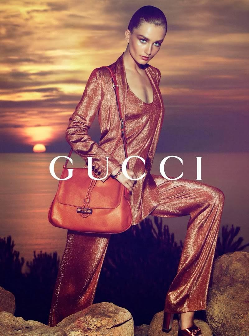 New Runway Gucci Pant Suit
Famous style, featured on runway and in many fashion editorials.

Designer size 40.
Iridescent rust liquid lamé deconstructed jacket. Single button closure. Fabric: 43% Viscose, 39% Silk, 18% Polyester. Retail is