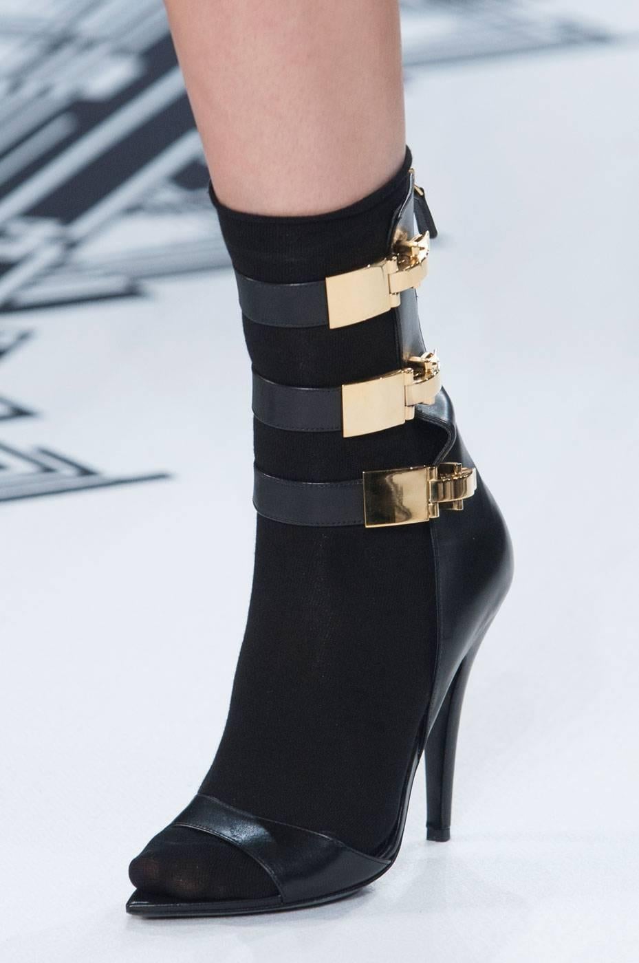 HOTTEST 

Versus Black Leather Calf-High Anthony Vaccarello Edition Sandals

Calf-hight buffed leather sandals in black. 

Pointed-toe. Gold-tone hardware. 

Decorative claps at straps. 

Zip-closure at heel counter.
 
Approx. 4 heel. 

Part of the