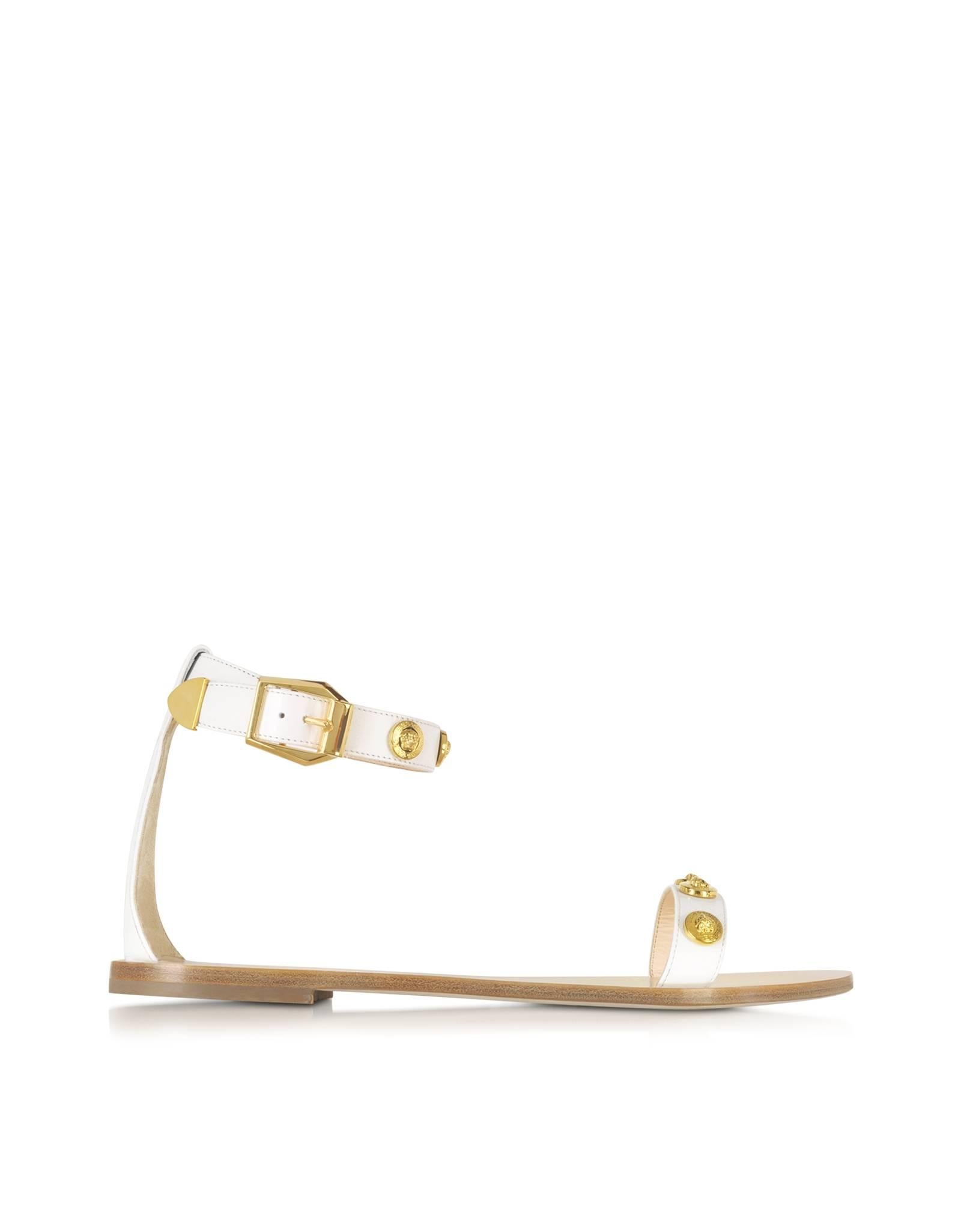 VERSACE 

SOLD OUT EVERYWHERE!!!

Ankle strap sandals

These sandals from Versace featuring Medusa gold metallic studs, open round toe, buckle fastening ankle strap.

100% leather
 
IT Sizes:  35.5, 38

Made in Italy

Brand new. In VERSACE box