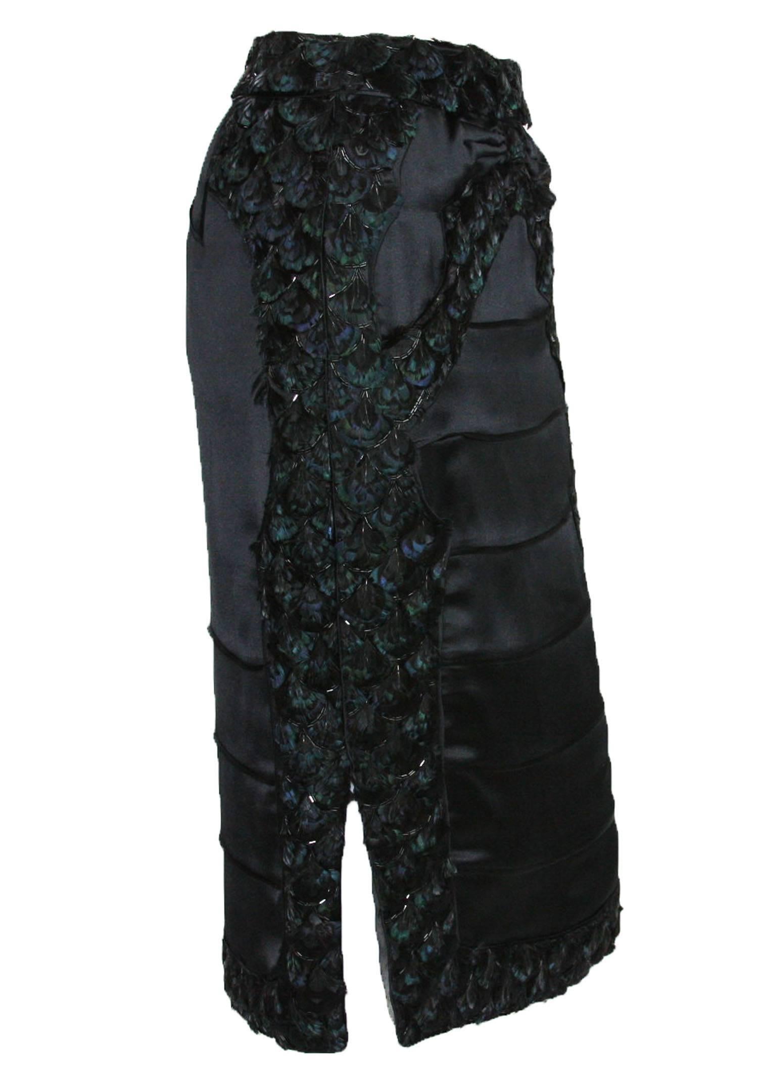 New Tom Ford for Yves Saint Laurent Embellished Silk Skirt
Fall/Winter 2004 Collection
Fr. size 38 - US 6
Color - Black
100% Silk
Embellished with Black Beads & Feathers
Fully Lined
Zip Closure at Side
Made in France
New with tag.
