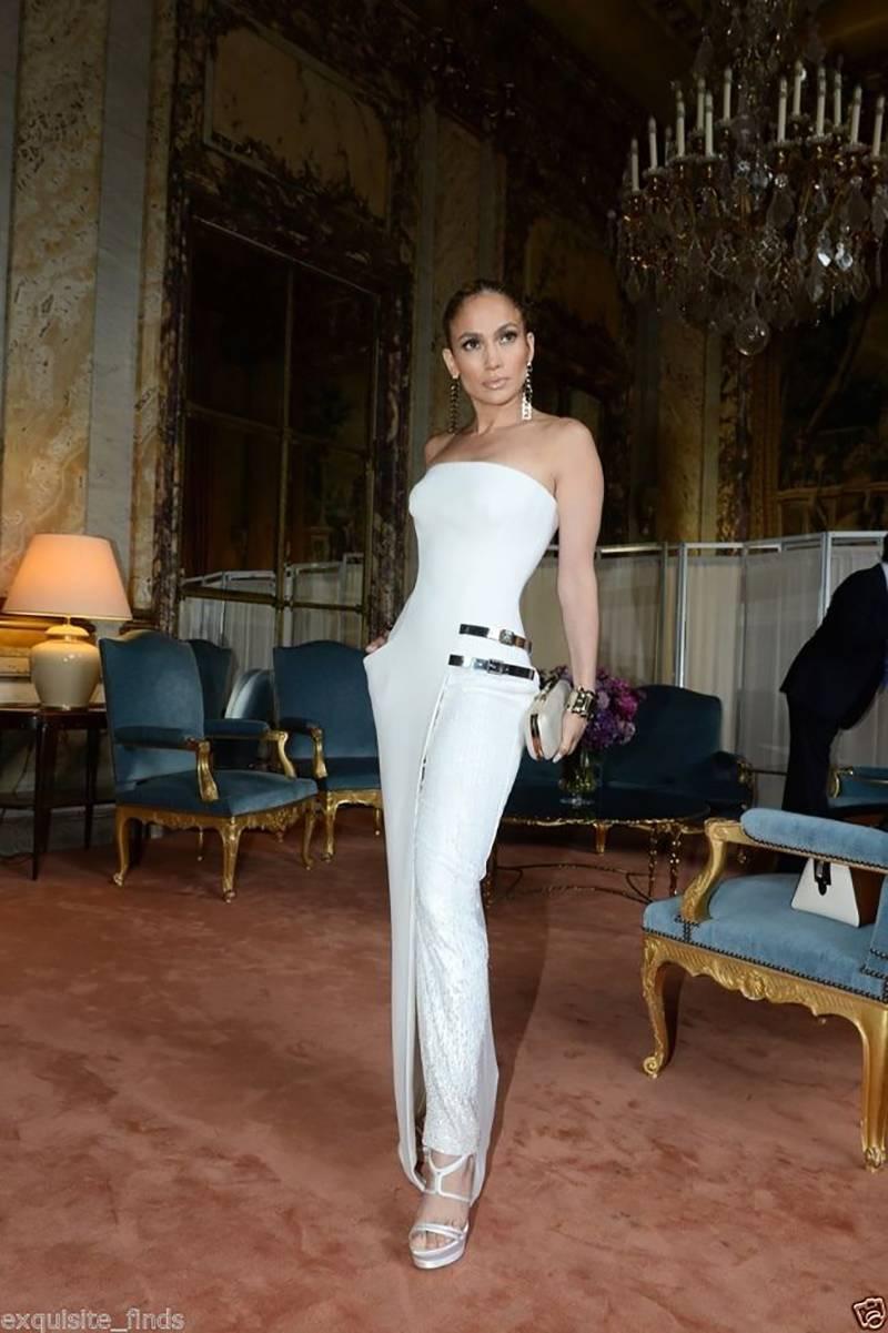 VERSACE 

High heel sandals with buckle features and double platform. 

As seen on Jennifer at Versace Atelier show in Paris and Irina on several red carpet occasions!

White Silk

Heel 5 1/2