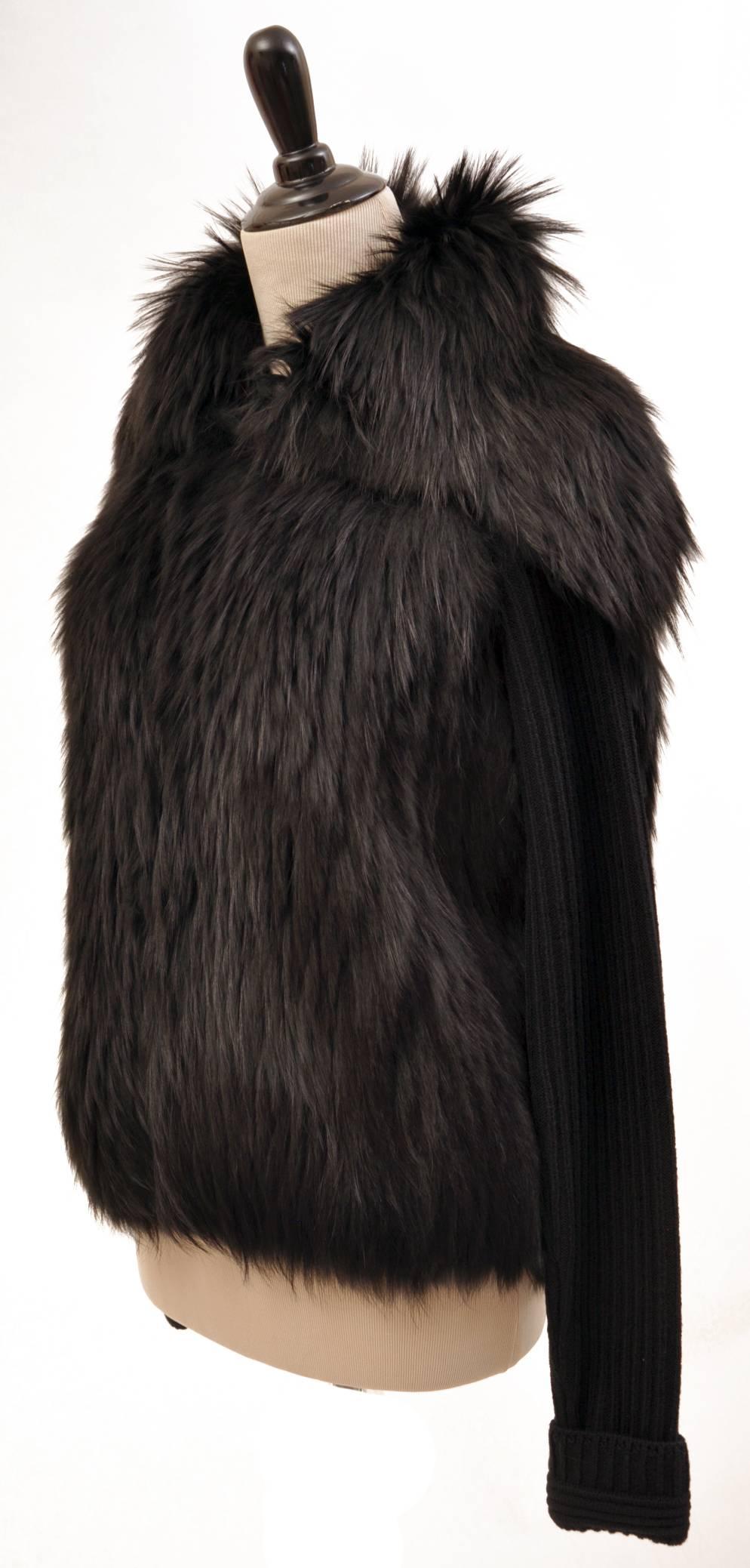 This sweater from Versace
features full-length sleeves,two pockets, and oversized collar.

95% wool, 5% elastine with 100% raccoon fur

Made in Italy

IT sizes: 42 and 44

Retail price is $6,125.00

New, with tags.

Due to restrictions, this item