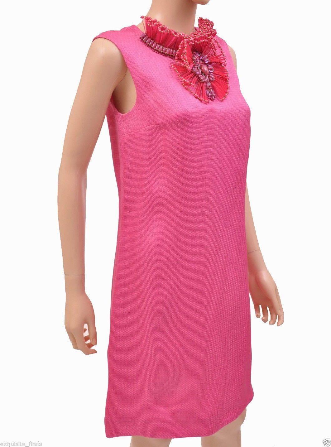 GUCCI RAFFIA DRESS 

100% silk
Hot pink
Discreet back zipper
Floral embellishment around the neck
Fully lined
Made in Italy
Size 40 or US 4