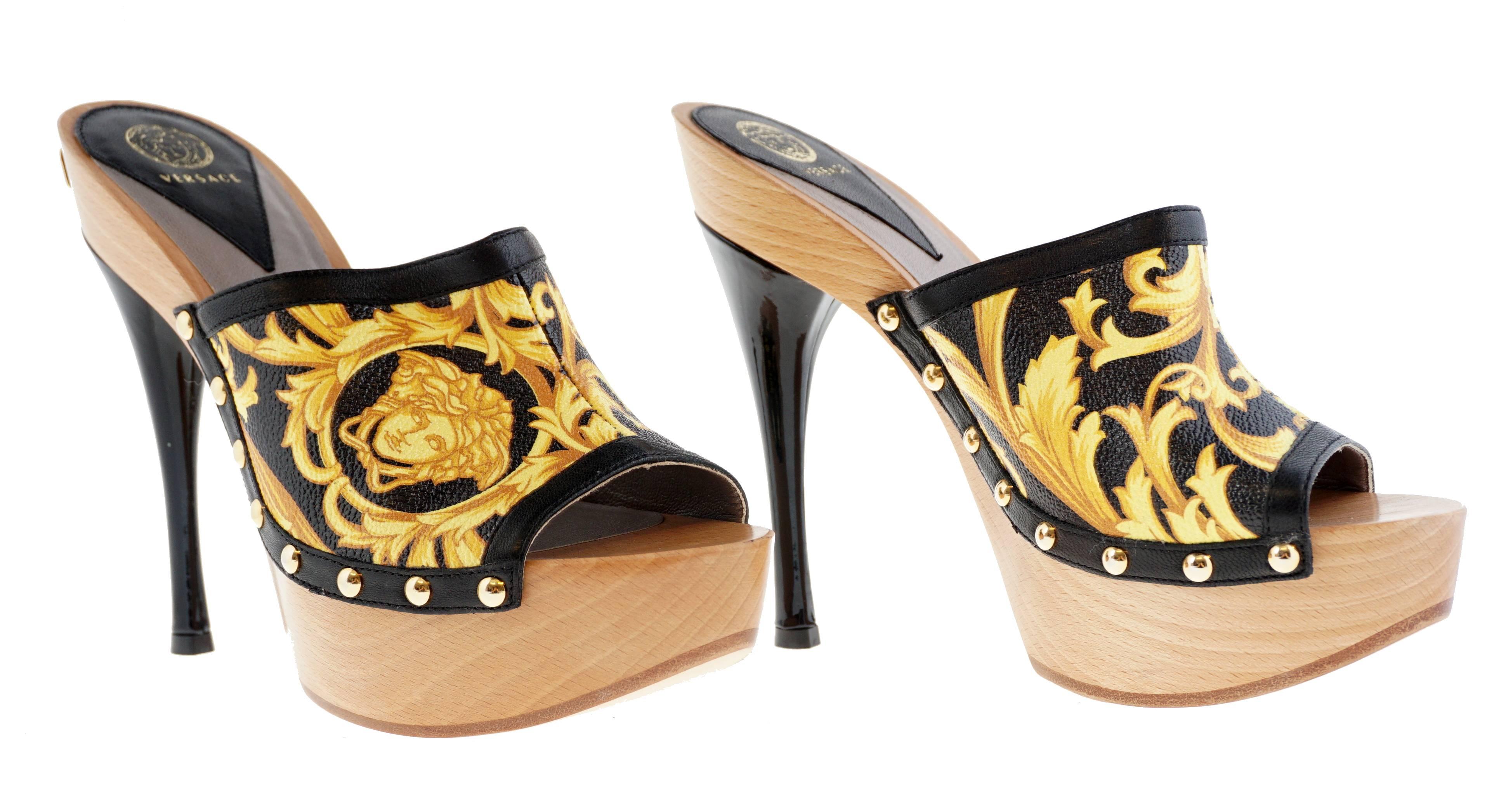 VERSACE 

Turn heads on vacation in these iconic Barocco high-heeled clog sandals.

Leather sole.

Leather: Calfskin.

Made in Italy.

Measurements:

Heel: 5.5 in / 140 mm

Platform: 2 in / 50 mm
 
IT Size 37.5 - US 7.5

Made in