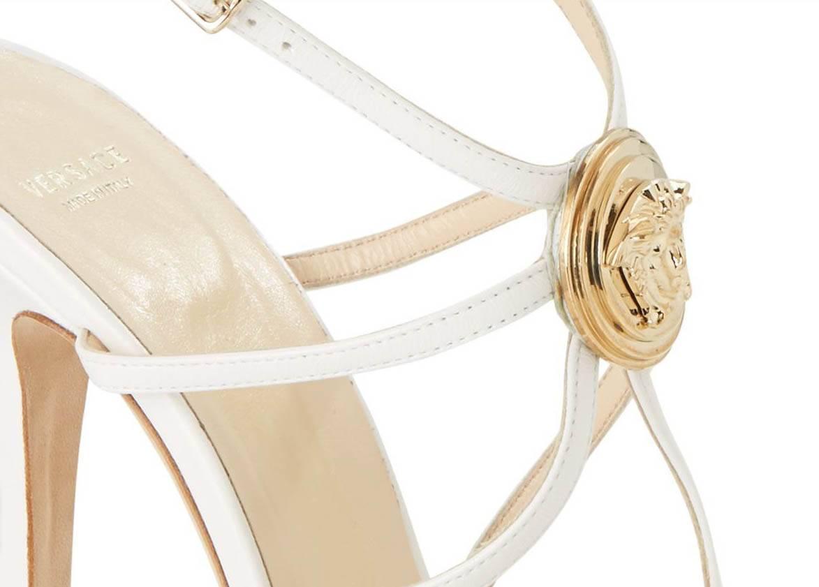 VERSACE SANDALS

Slip into these platform sandals to make an unforgettable impression at your next cocktail party.

Color: White

100% Leather

3-D Medusa medallion

Made in Italy

IT Size 37.5

New, in the box.