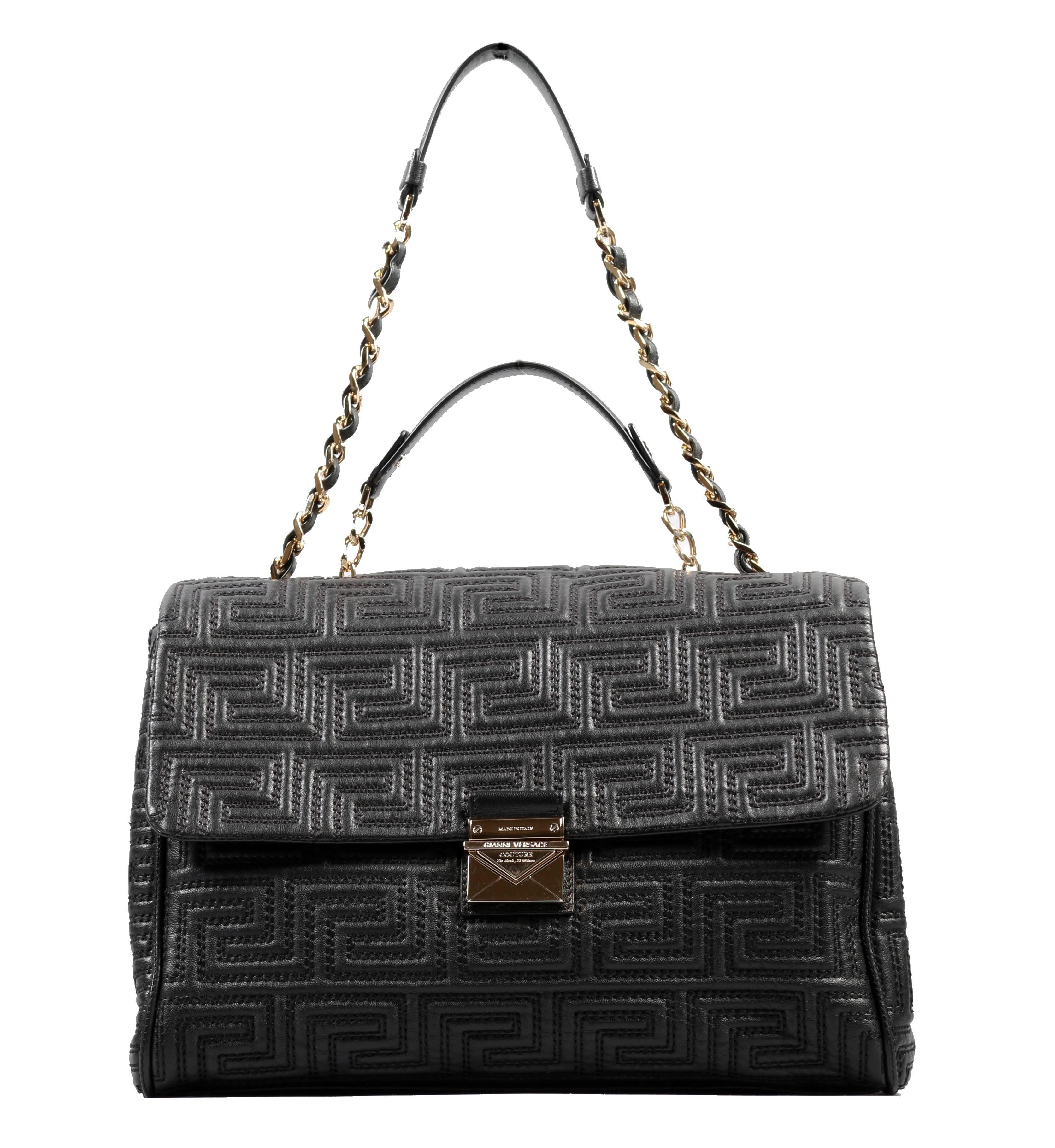 GIANNI VERSACE COUTURE 

 Quilted  leather large day bag with geometric design,  
 
golden metal chain and black leather shoulder strap,
  
fastening with leather flap and golden metal tongue with logo.  
 
Internal lining, open pocket and zipped