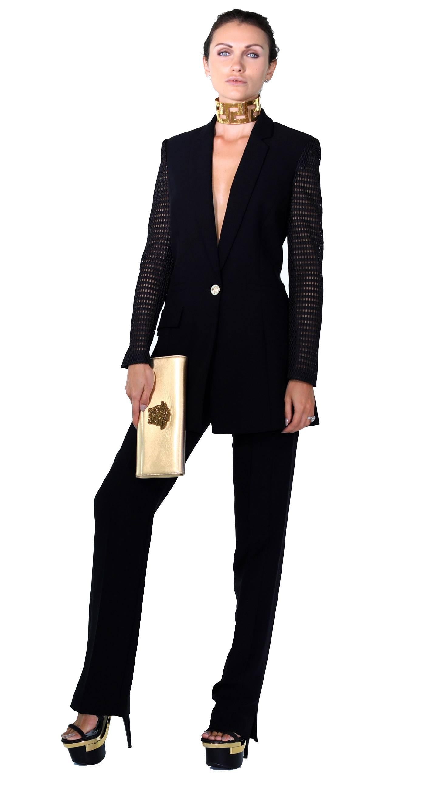 Brand New 

VERSACE

Pant Suit

Detailed with perforated sleeves

IT Size 38 - US 2

100% Silk

New, with tags. 

Comes with Versace hanger and Versace travel garment bag.