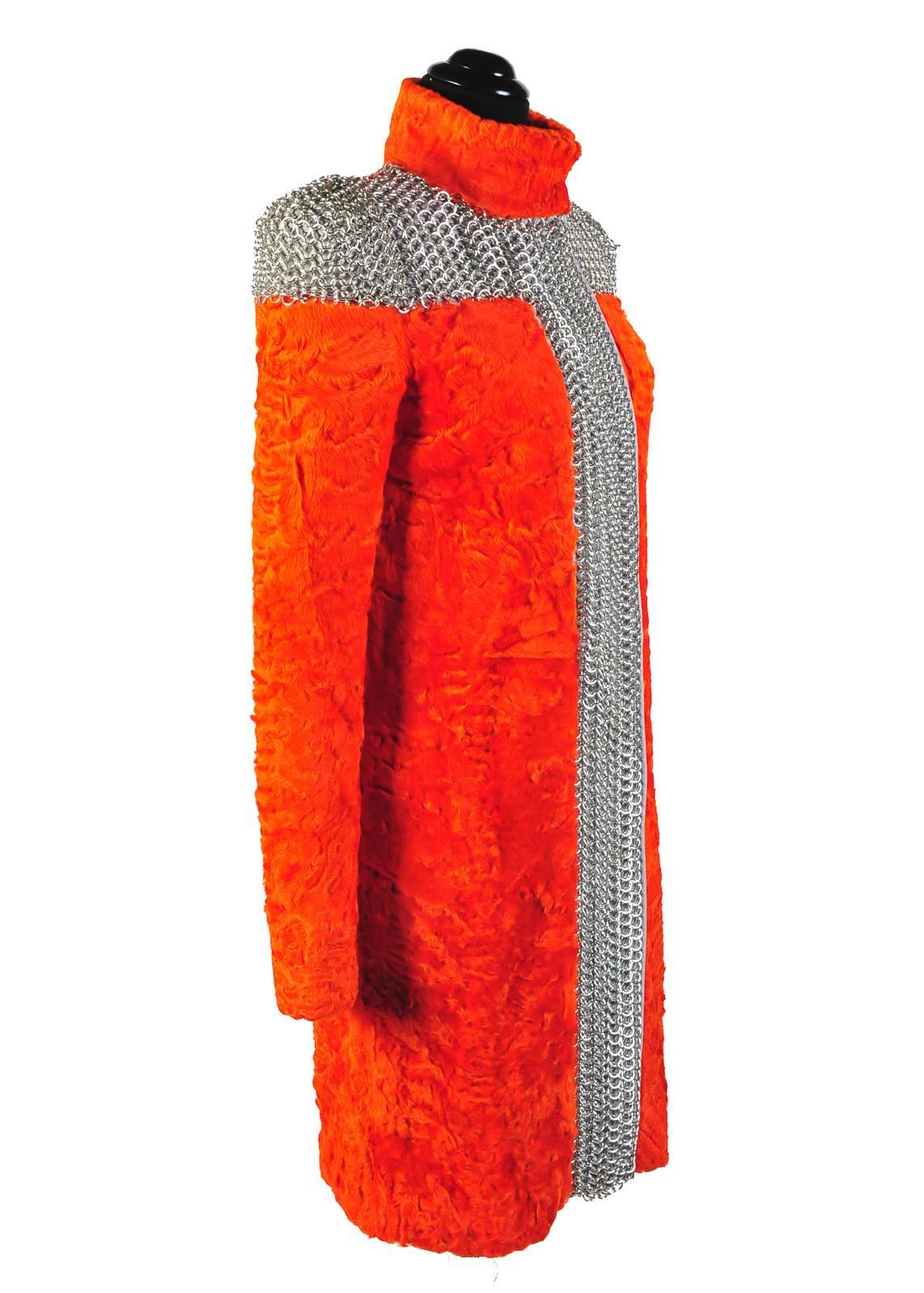 VERSACE

ORANGE PERSIAN FUR METAL MESH COAT

 Versace's coat is the ultimate luxury for the fashion-forward. 

IT Size 38, US 2

Guaranteed to turn heads & stop traffic whenever & wherever you wear it!

Made in Italy

Brand new, with
