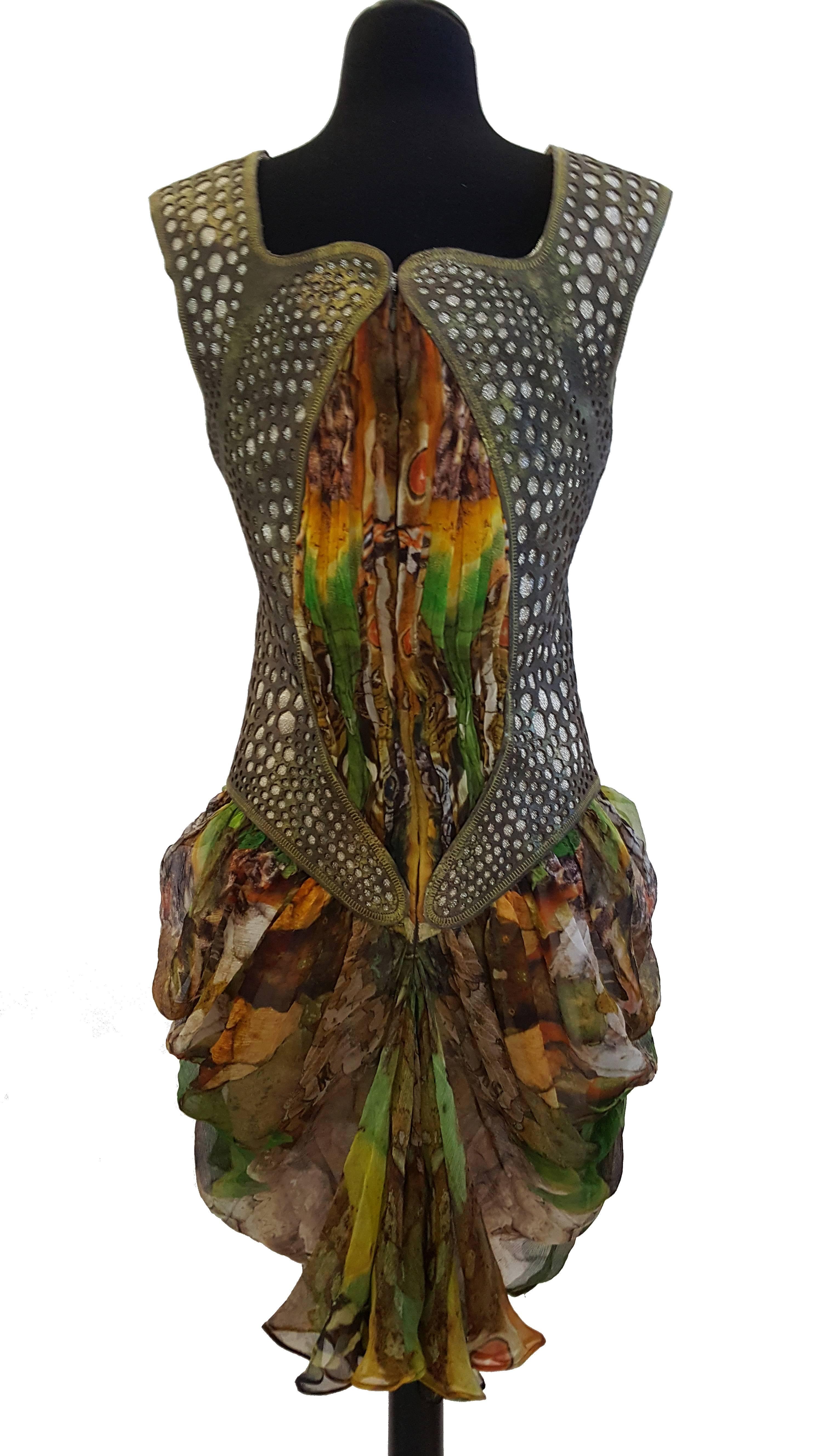 HIGHLY COLLECTIBLE DRESS THAT FEATURED IN MET MUSEUM!

Alexander Mcqueen 
Plato's Atlantis Silk Dress with Leather
    

From the infamous Spring Summer 2010 ALEXANDER MCQUEEN 