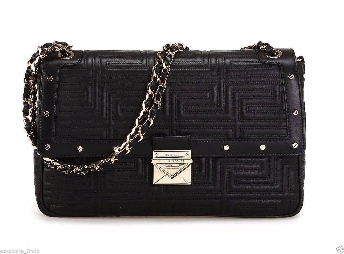 GIANNI VERSACE COUTURE

Quilted leather shoulder bag with geometric design, small golden metal studs and details, 

golden metal chain and black leather shoulder strap, 

large open pocket on the back, fastening with leather flap and golden