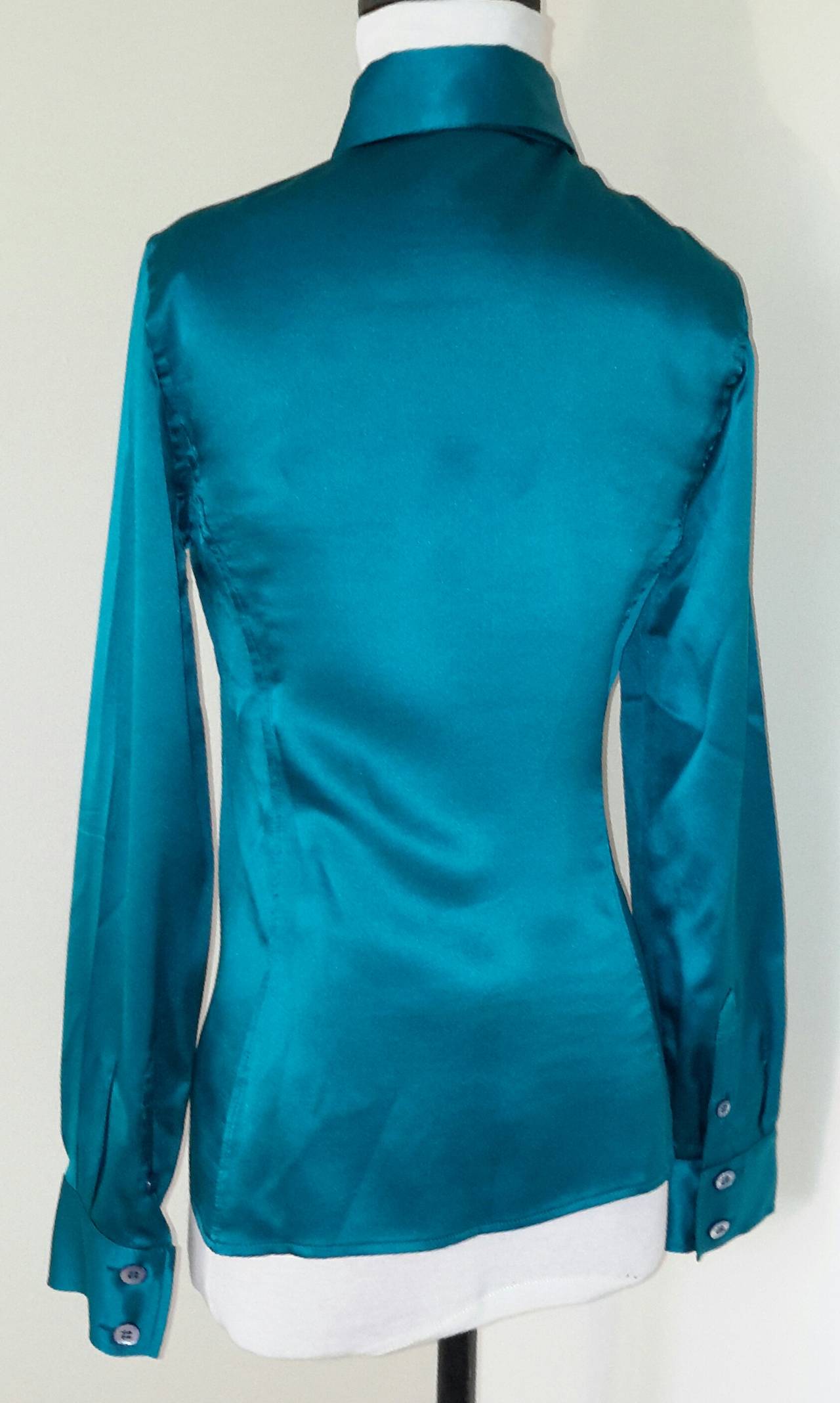 Tom Ford for Gucci Fall 1995 famous blue silk shirt as worn by Madonna, on the runway by Kate Moss and in the ad campaign, also with various editorials in Vogue and Harpers Bazaar.

This shirt is in amazing condition, and is XS, or IT 38. Please