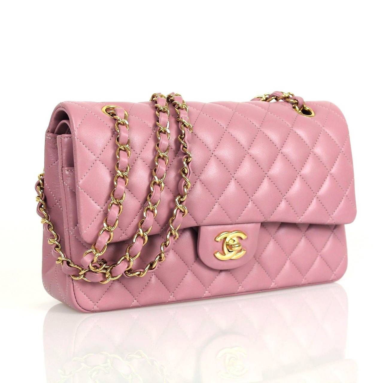 This authentic Chanel Jumbo Classic in lilac lambskin leather is unworn. Like all the new jumbo classics, this is a double flap style.Durable glorious lilac lambskin leather is quilted in signature Chanel diamond stitched pattern. Complimentary gol