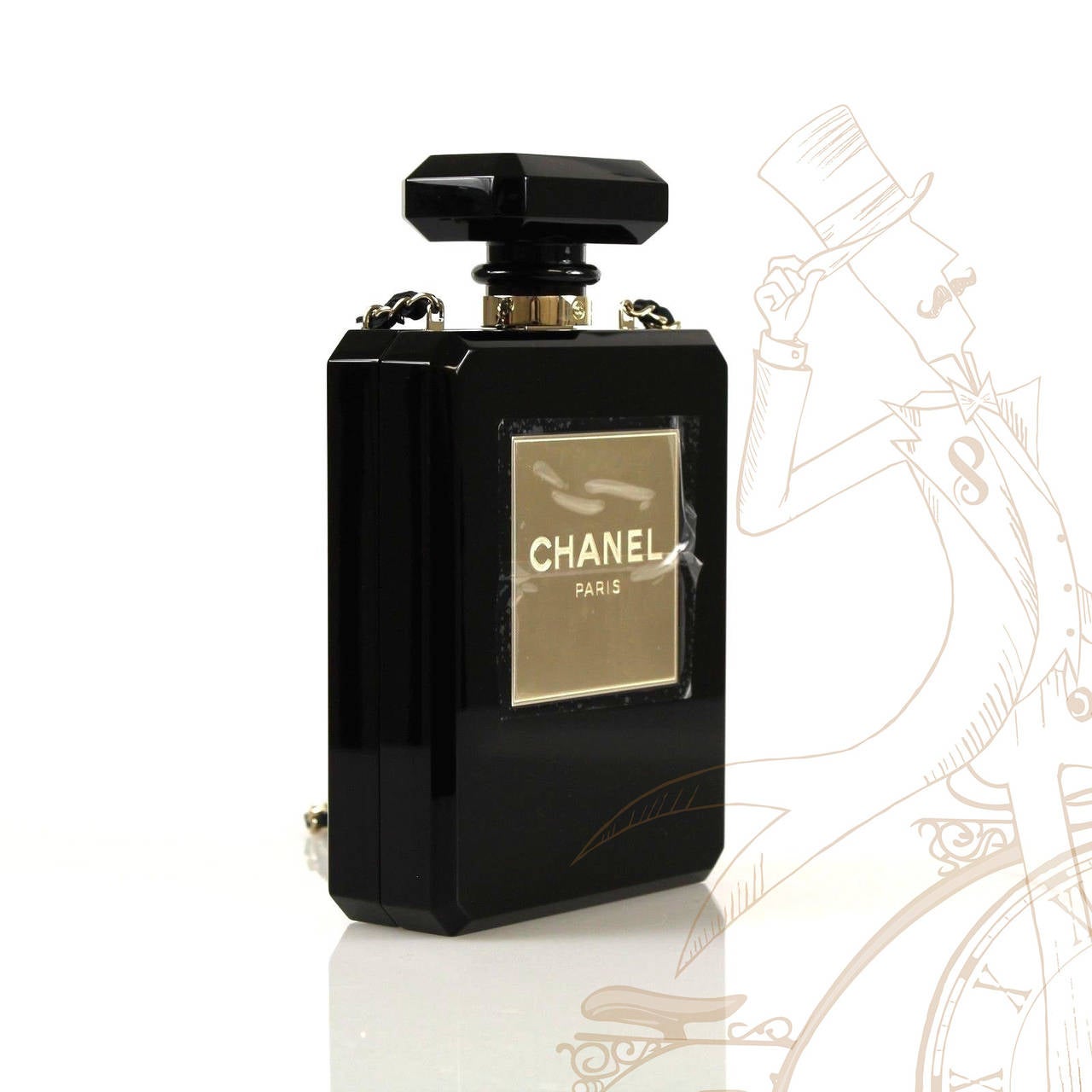 Limited Edition sold out CHANEL perfume bottle bag in black plexi glass! This fabulous piece is worn as a clutch or shoulder. The absolute timeless essence of CHANEL! Black leather interior. Signature CHANEL stamp inside the bag. Serial number on