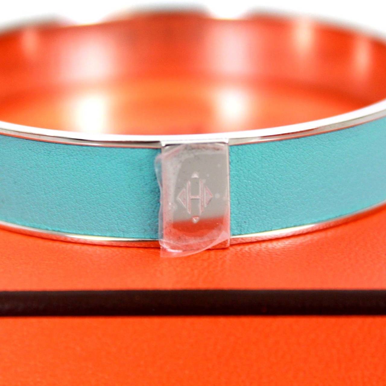 Hermes hard to find, Blue atoll bracelet made with a textures material, and stainless steel hardware.