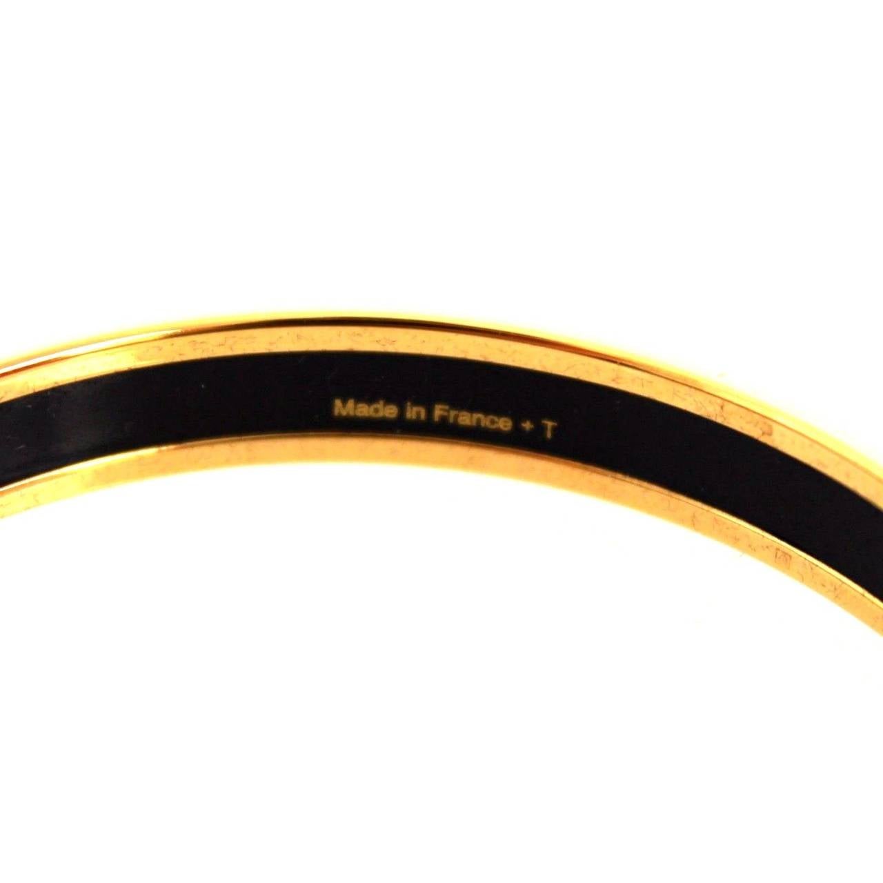Hermes narrow printed enamel bracelet

Gold plated, 0.5