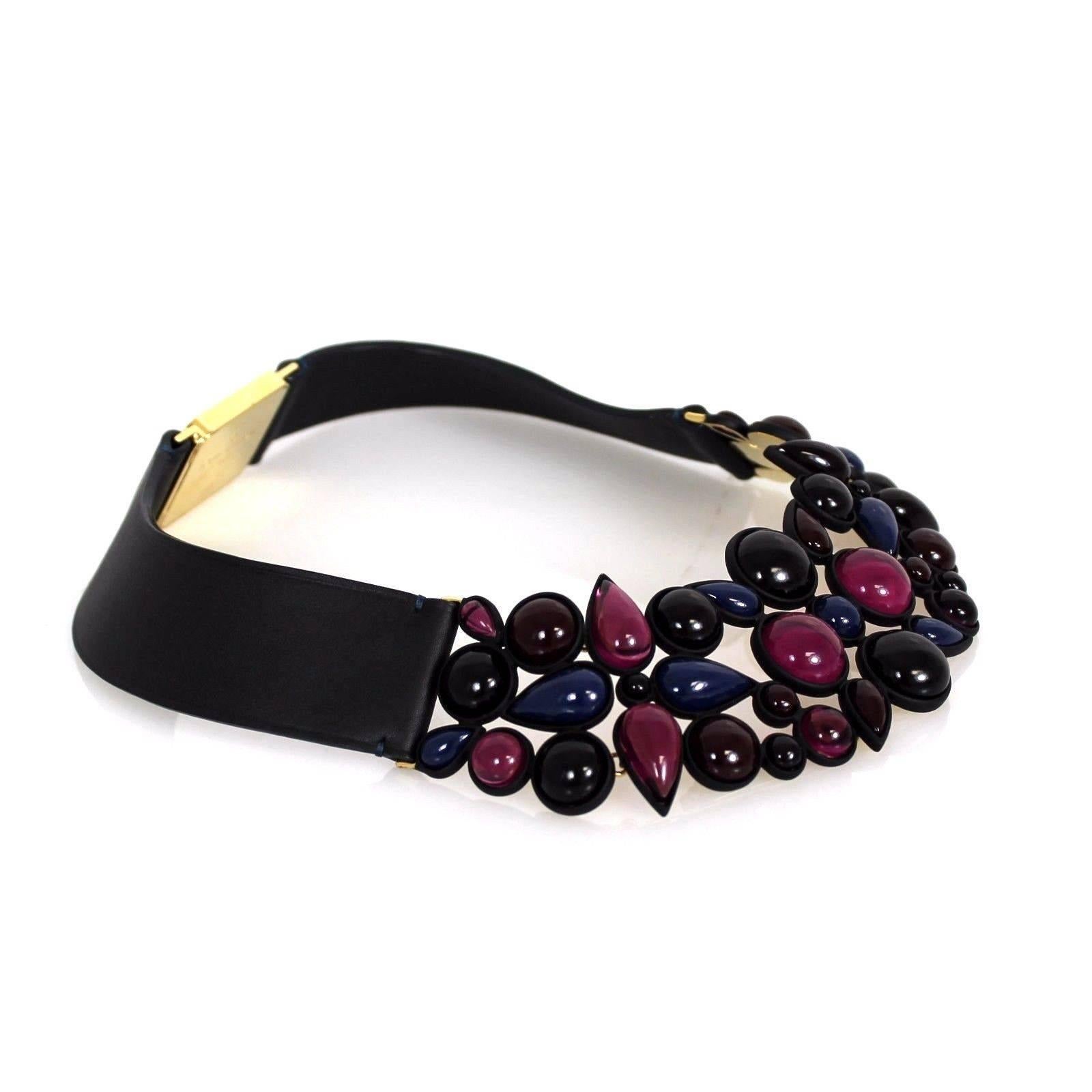Louis Vuitton bold collar necklace. Thick to make a statement and take any ordinary outfit and turn completely pieced together. Features: Various size and shapes of shades of purple, indigo, and the deepest of plums, Gold hdw, a click closure on the
