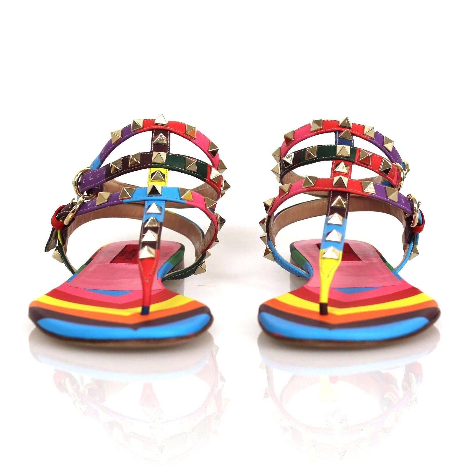 Rainbow Rockstud Gladiator Sandals from Valentino. Gladiator leather sandals feature a T-strap design, gold tone studs and embellishments, rounded toes and a multicolor chevron stripe pattern. Fits true to size. Leather. Made in Italy.

Includes: