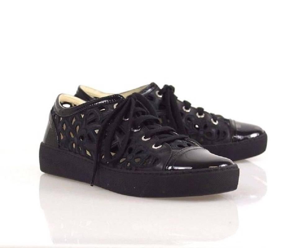 Item Description
Black Chanel cutouts sneakers with leather cap-toes and counters, embroidered CC at counters and laces. 

Includes: Box and dust bag 

Conditions: Like new, just a little wear on the sole and insole 

About us:
We are a
