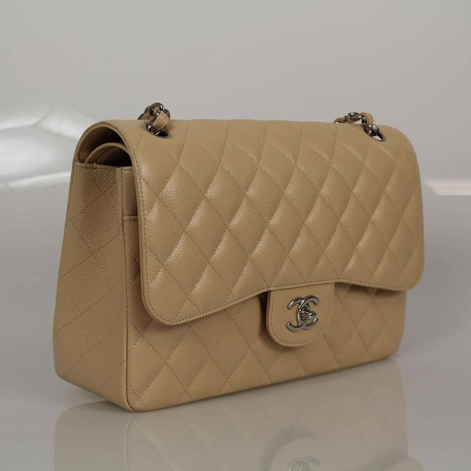Item is new without tags 

This authentic Chanel Jumbo Classic in beige caviar. Like all the new jumbo classics, this is a double flap style.Durable glorious beige caviar is quilted in signature Chanel diamond stitched pattern. Complimentary