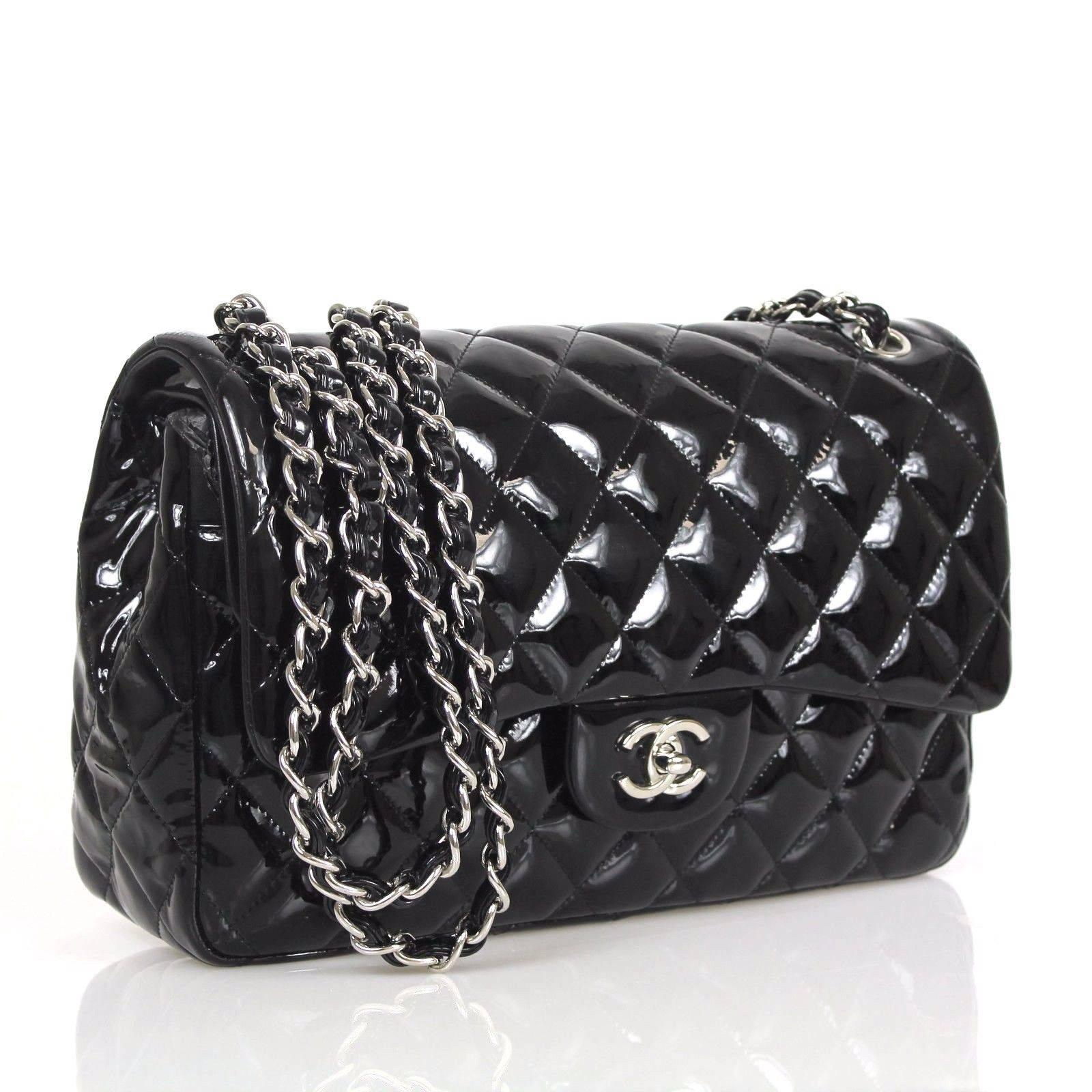 This authentic Chanel Jumbo Classic in black patent leather in great condition. Like all the jumbo classics, this is a double flap style.Durable glorious black patent leather is quilted in signature Chanel diamond stitched pattern. Complimentary