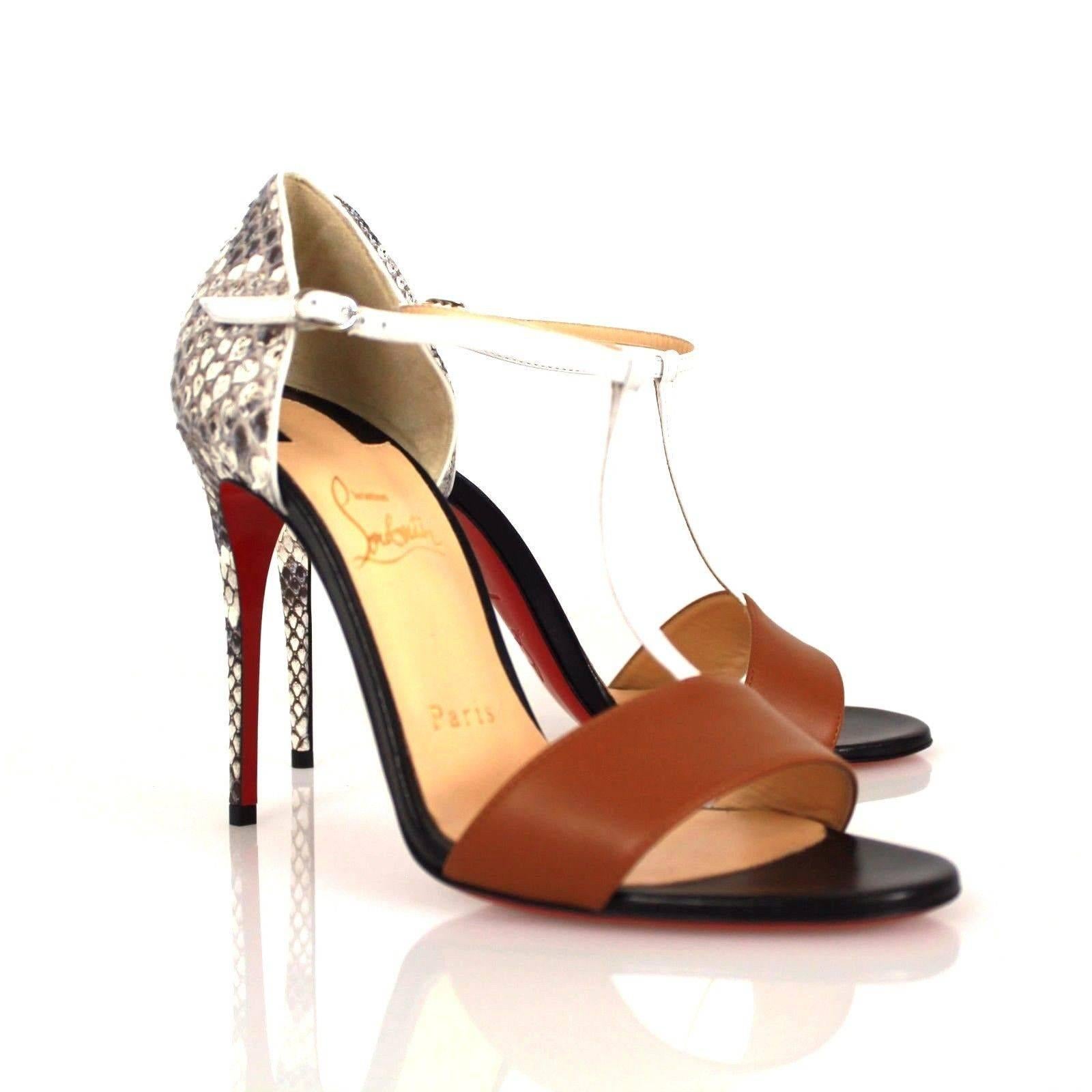 Christian Louboutin, most known for its gorgeous signature red sole. Presents and classy elegant sandal. Beautifully decorated with python on the heel with a bluish tint to it and neutralized with camel leather at the front. 

Conditions: Was once