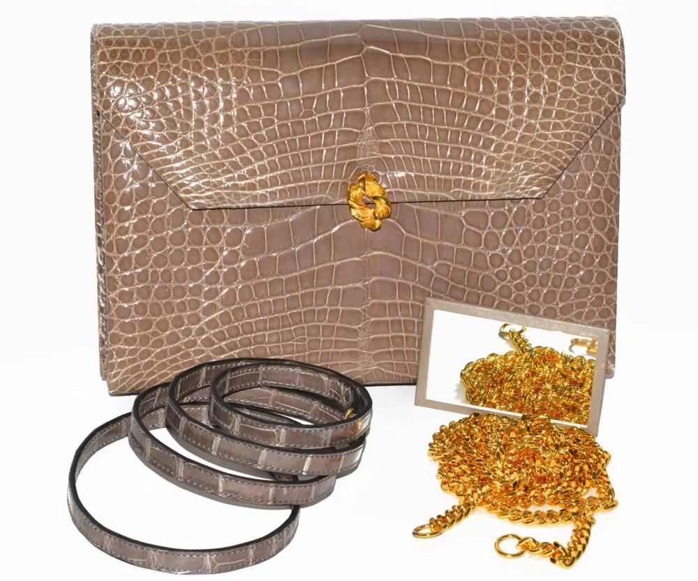 Magnificent vintage Helene Arpels Alligator clutch with detachable shoulder strap.  Pristine condition, gorgeous skins. NO CITIES DOCUMENTATION AVAILABLE. MAY ONLY BE SHIPPED WITHIN THE UNITED STATES>