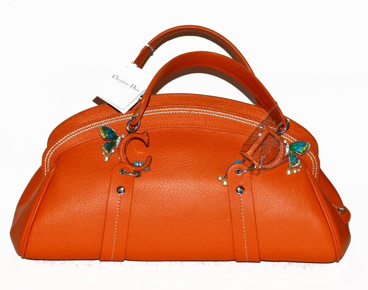 Gorgeous Christian Dior limited edition, brand new, with tags, Butterfly Detective satchel style bag in CORAL leather (pics difficult to capture this gorgeous coral color). 10" x 7" x 5"