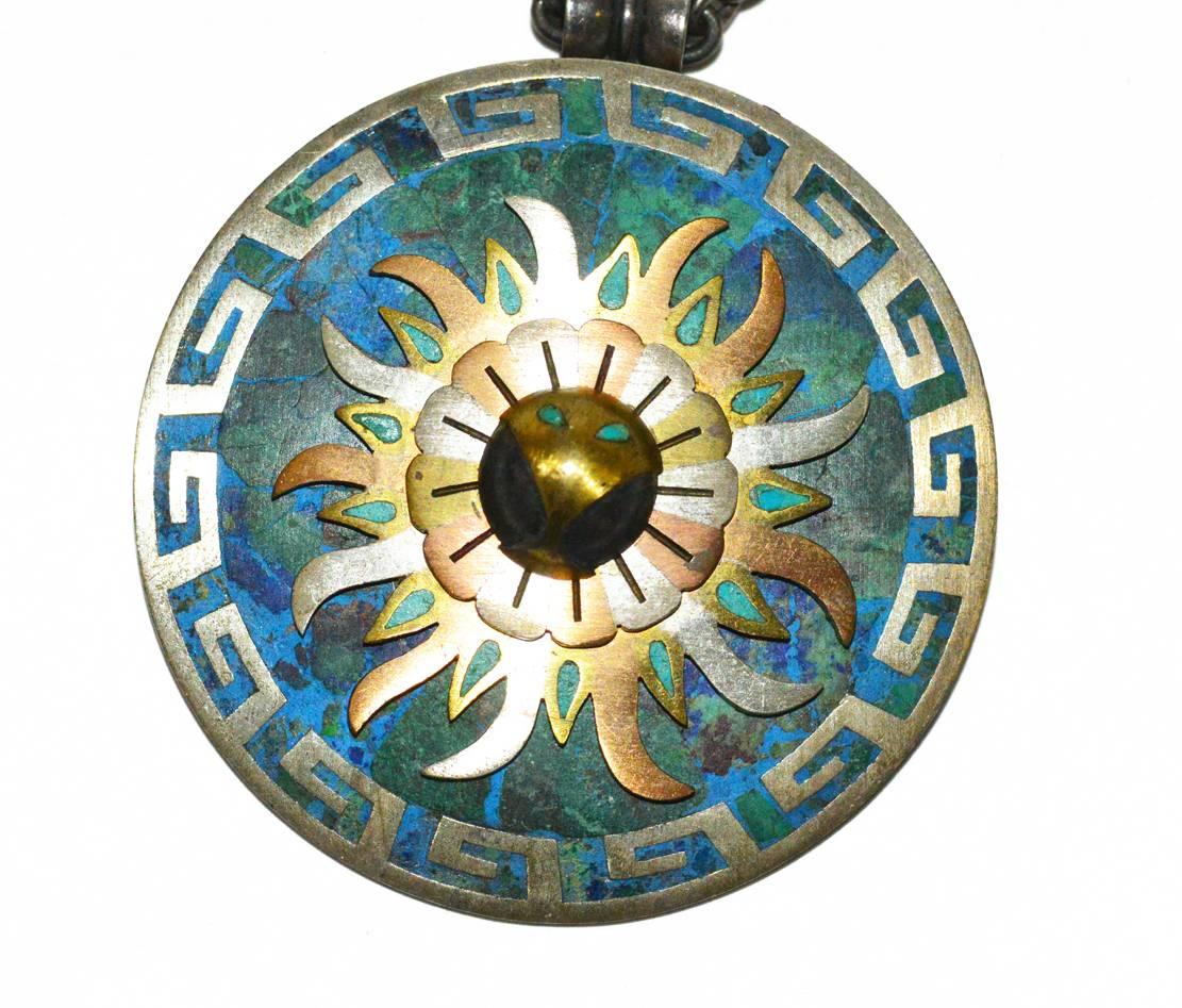 This is a gorgeous, early piece, signed by renowned Mexican artisan Cecilia Tono. It is a necklace and detachable pin/pendant. All hand made, the chain is sterling silver.  The detachable sunburst design pendant/brooch, is sterling with smooth