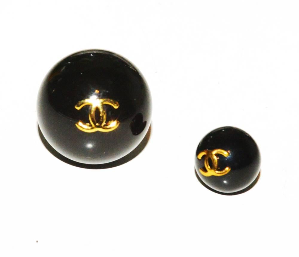 Set of vintage Chanel ball/logo buttons. There are 3 large and 10 small. Never used, mint condition.