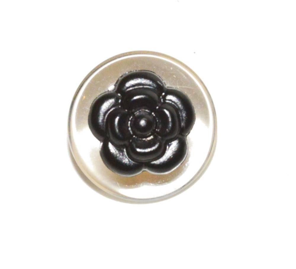 Chanel set of 18 clear lucite and black Camilla buttons.  (1) large, (4) medium, (13) small.  Pristine condition.