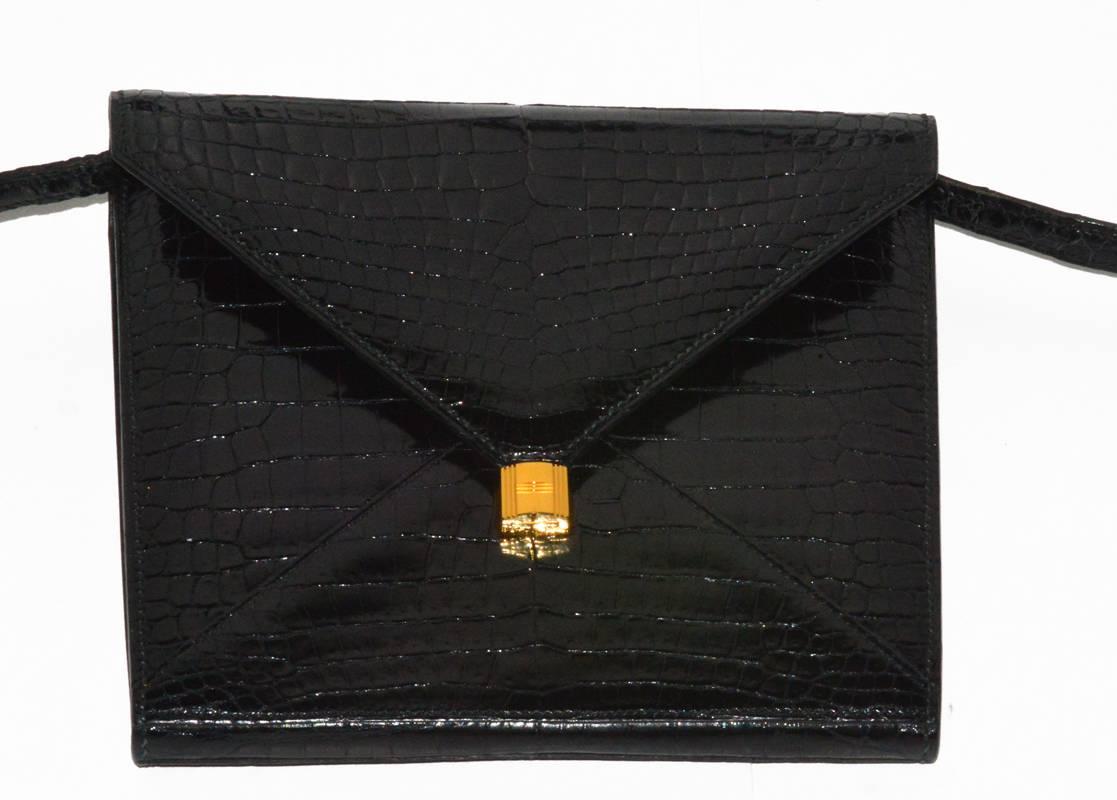 Rare and gorgeous Hermes 3-way Marigny black alligator bag. Can be worn as a clutch, shoulder (both long or doubled within the flap) or crossbody. Amazing condition. Circa 1984, with the older Hermes coach logo, this bag stands out.  It is a true