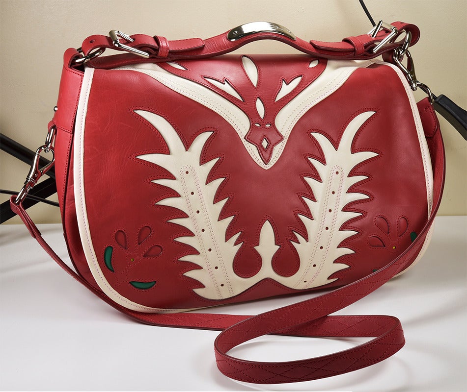 Fabulous runway Ralph Lauren Southwestern design red and white leather handbag. Never worn. 

All proceeds from the POSH Sale benefit Lighthouse Guild, the world-wide leader in helping people who are blind or visually impaired as well as those