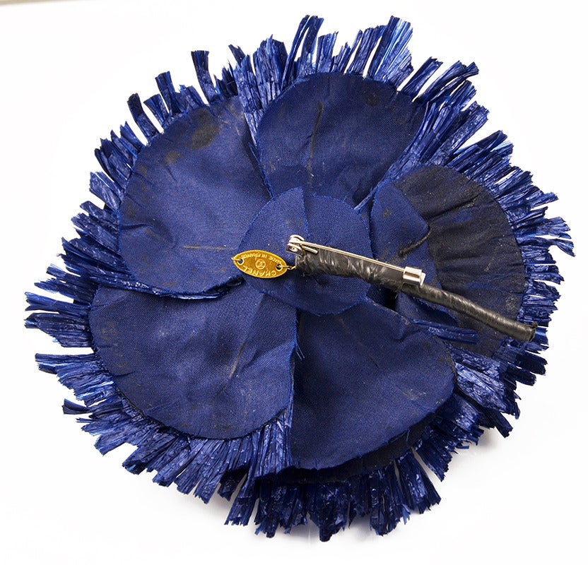 Lively Chanel blue straw flower brooch.