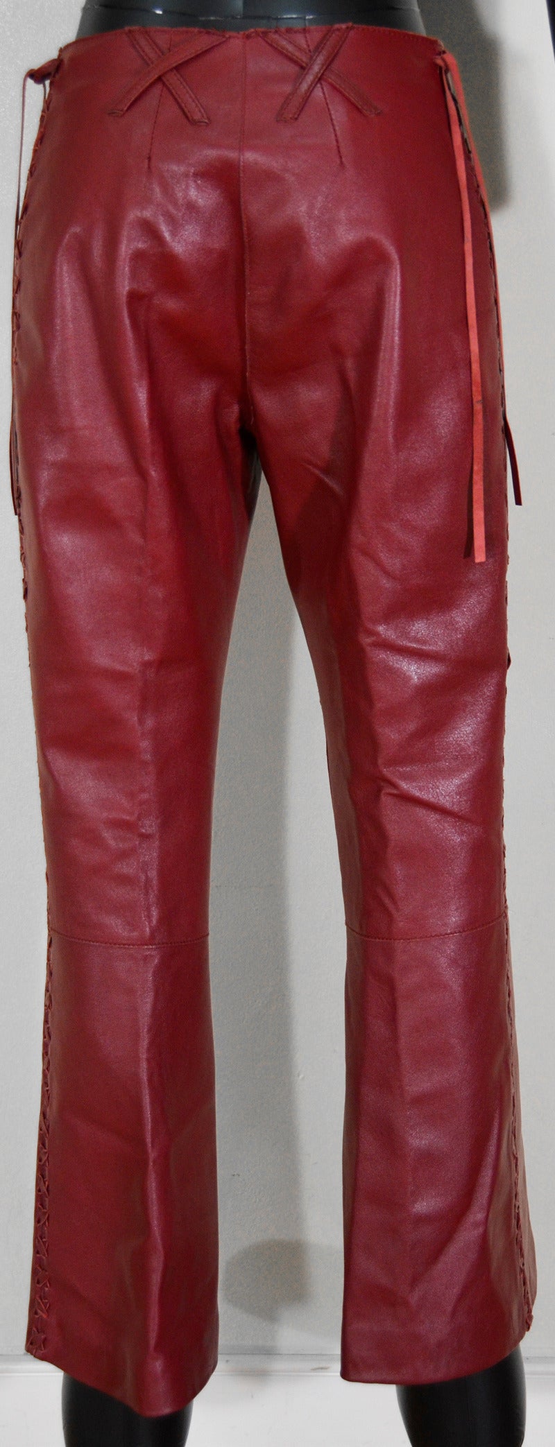 Dolce and Gabbana red leather pants, animal print lining...iconic...size 6...excellent condition.