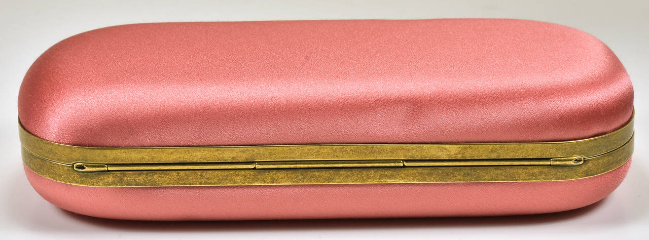 Gorgeous Marchesa coral silk clutch with rock crystal closure in pristine condition.