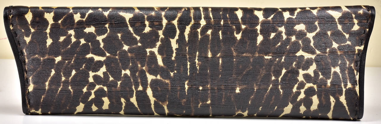 Every out fit, every season is enhanced with an animal print...perfect accent clutch by VBH in leopard. In pristine condition, ready to jazz up your wardrobe.