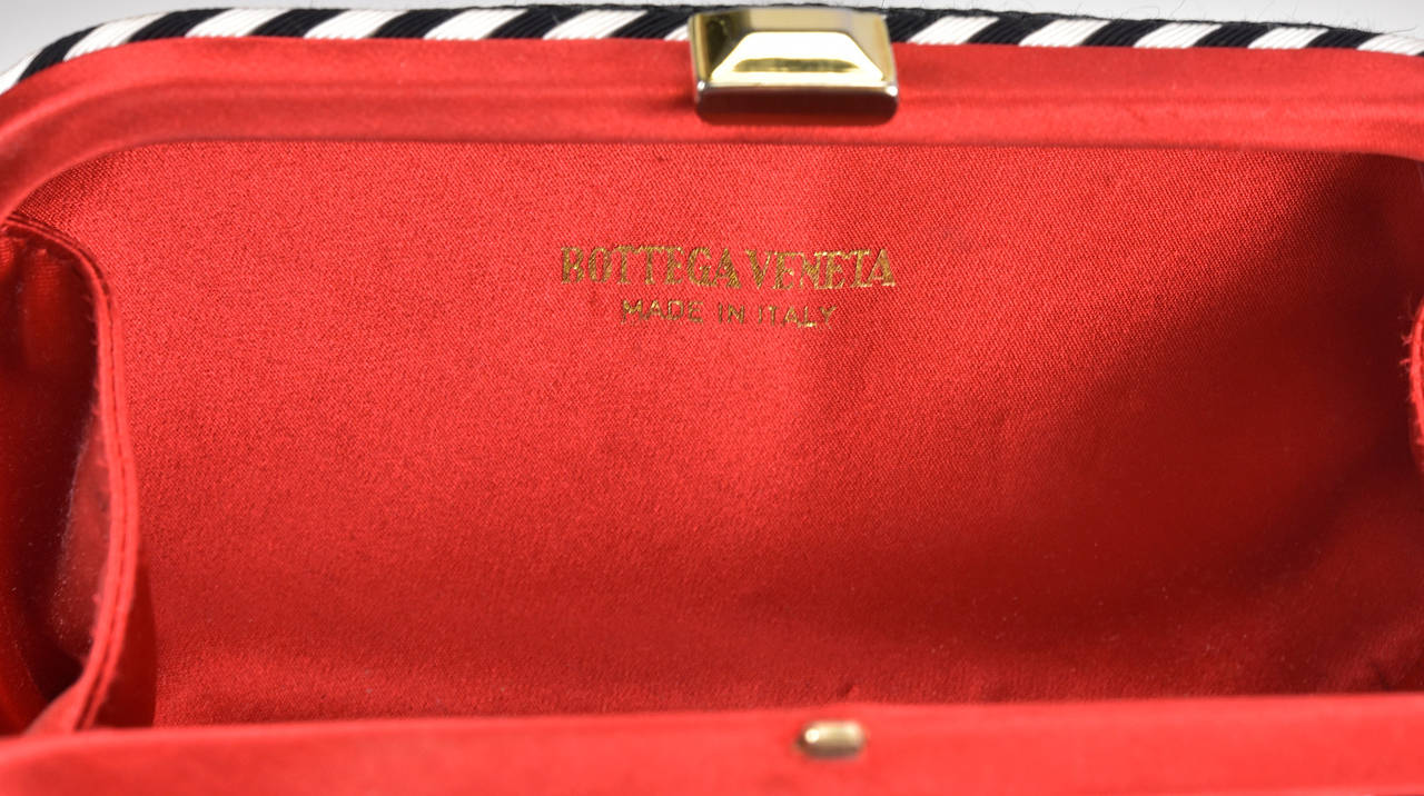 Rare Bottega Veneta Knot clutch bag in black silk with red and white Turin.  Stunning bag in pristine condition.