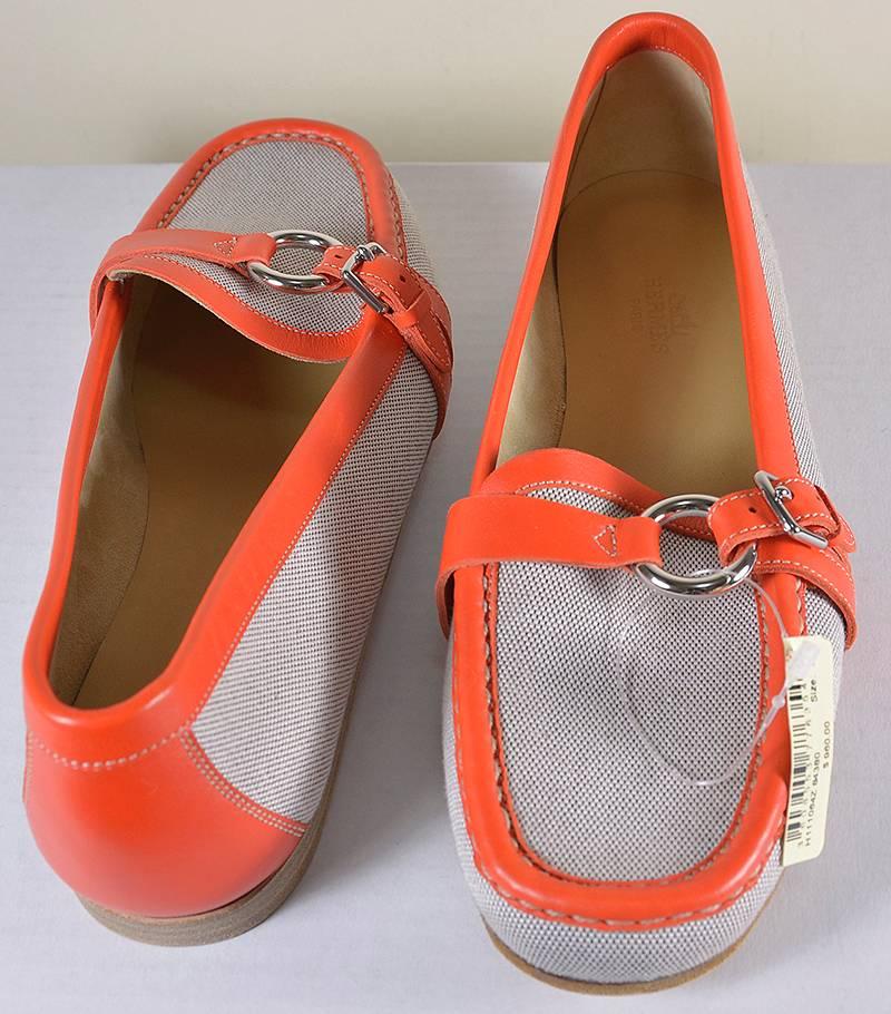 Hermes new loafers, size 38...natural canvas and signature orange soft leather. 